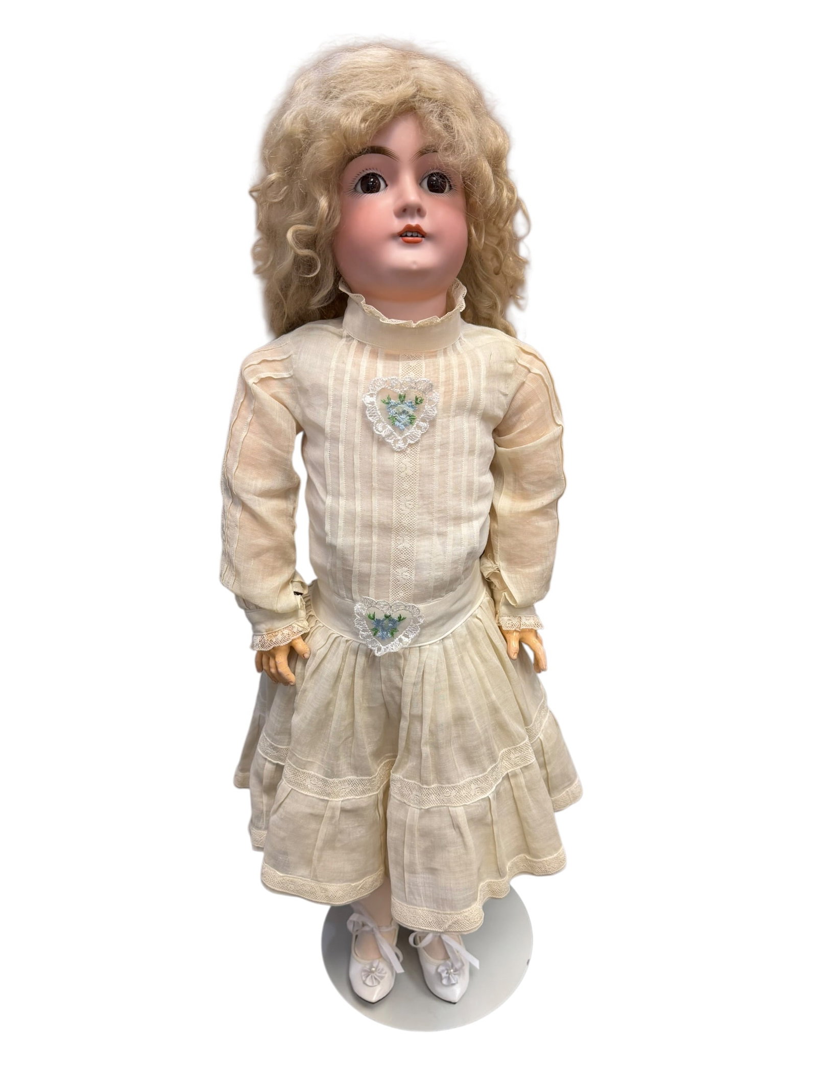 Germany Bisque Head Doll: vintage or antique bisque socket-head doll, a type of highly collectible doll produced predominantly in Germany and France from the late 19th century to the early 20th century. [1, 2, 3]Typical Featur