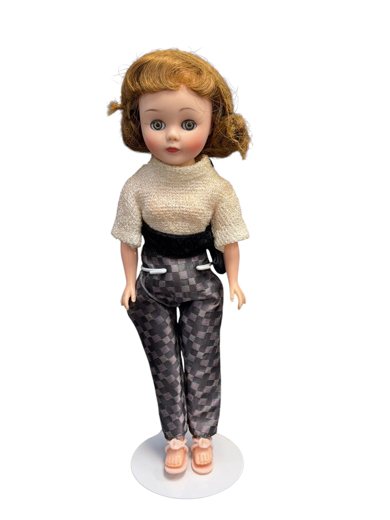 Madame Alexander Doll: vintage 1957 Madame Alexander Cissette doll, specifically in an outfit resembling the "Attired with Great Chic" ensemble featuring toreador pants. [1, 2]It seems to be a 10-inch hard plastic fashion d