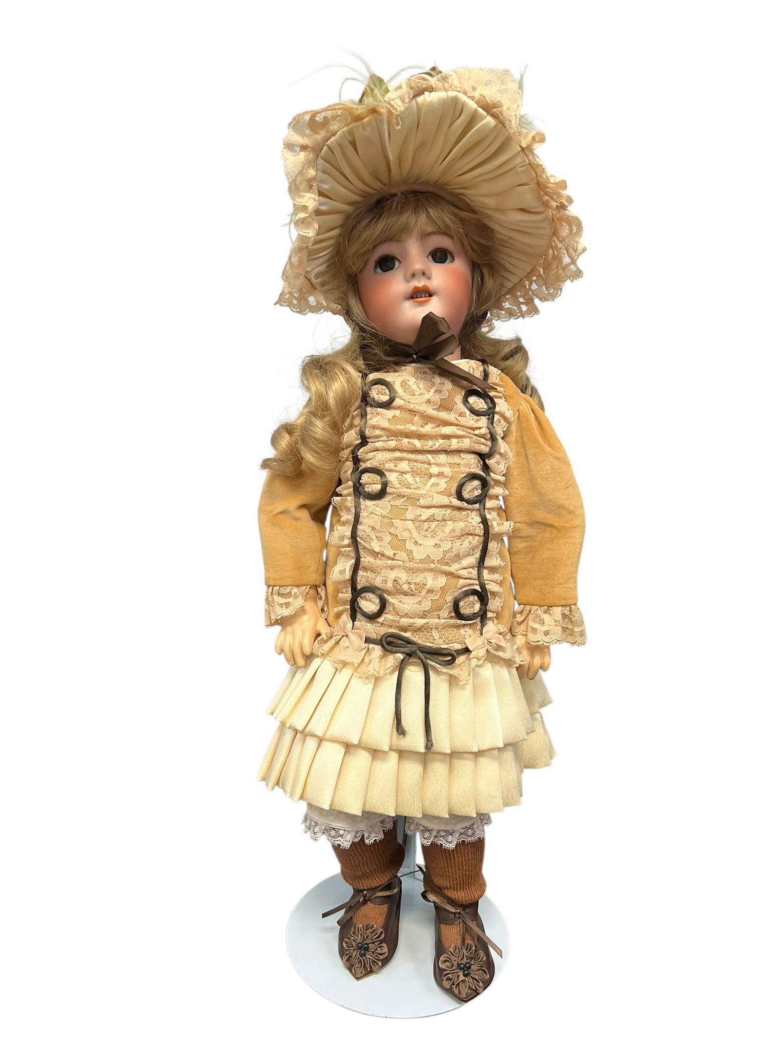 DEP Bisque/Porcelain Doll: antique bisque head doll, most likely of French or German origin dating back to the late 19th or early 20th century.Dolls with these classic characteristics—including a finely painted porcelain