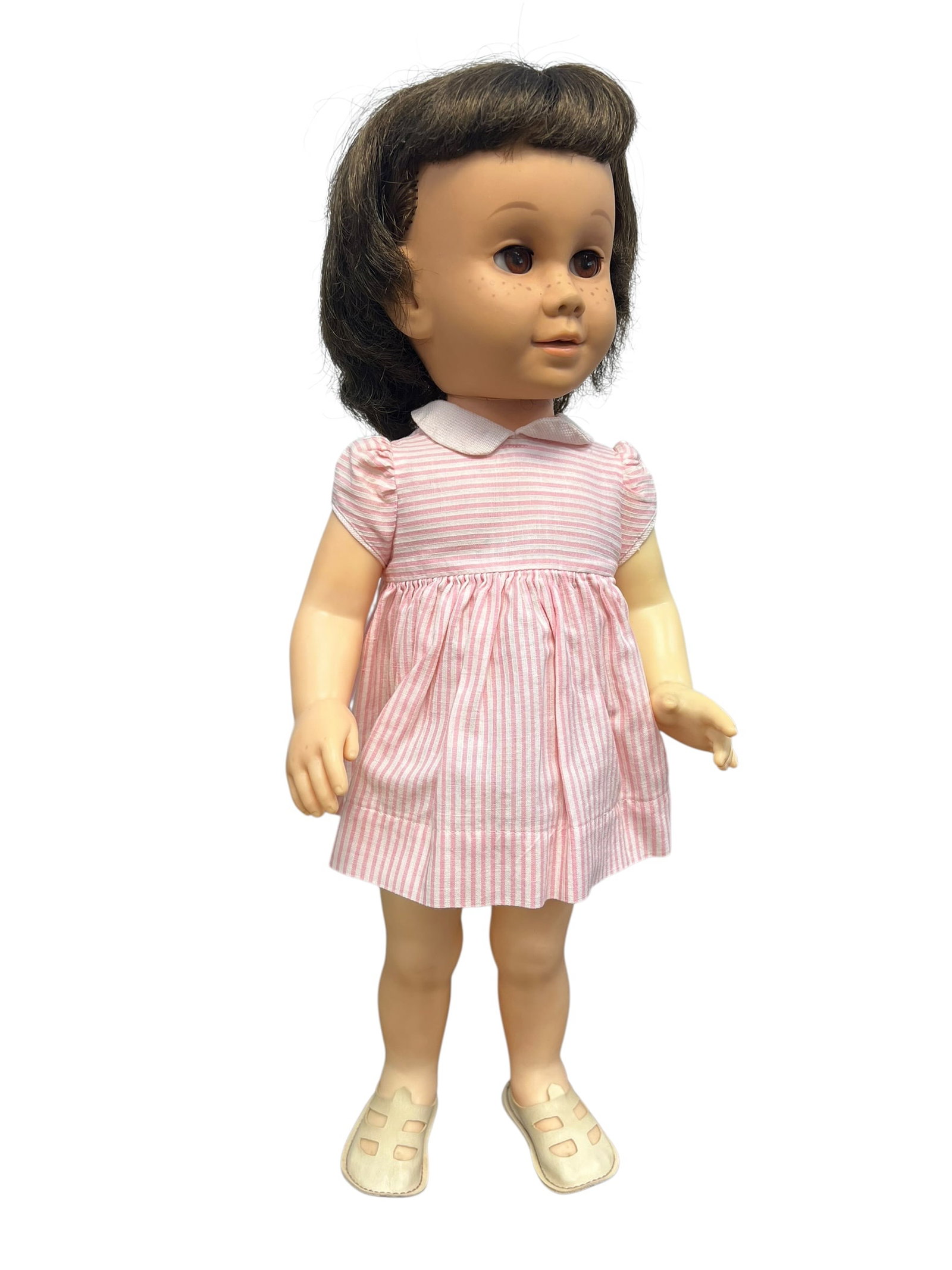 Chatty Cathy by Mattel Doll: vintage Mattel Chatty Cathy doll, a landmark pull-string talking toy originally manufactured from 1959 to 1965. This specific variant features brunette hair, freckles, and a less common brown-eyed con