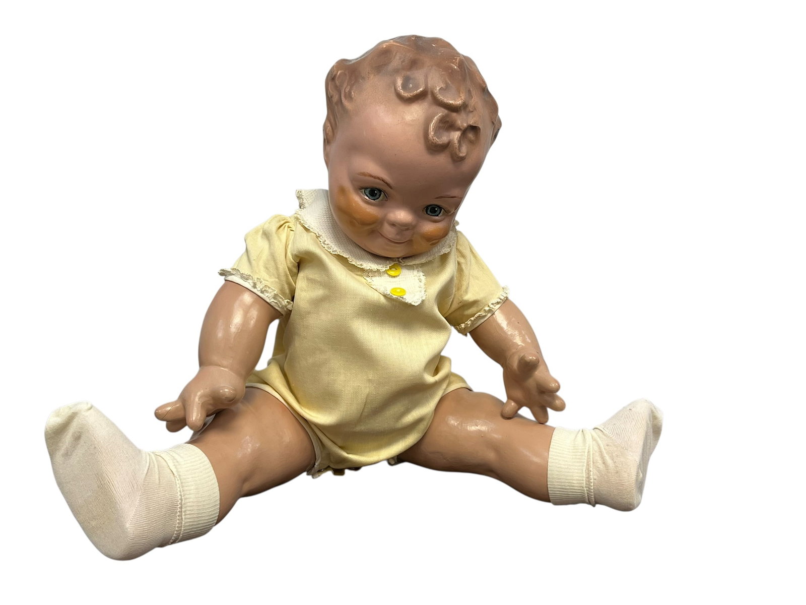 Vintage Composition Doll: The selected item appears to be a vintage Ricky Jr. (Little Ricky) doll manufactured by the American Character Doll Company around 1953. [1]Key FeaturesFace and Hair: Molded brown curly hair, painted