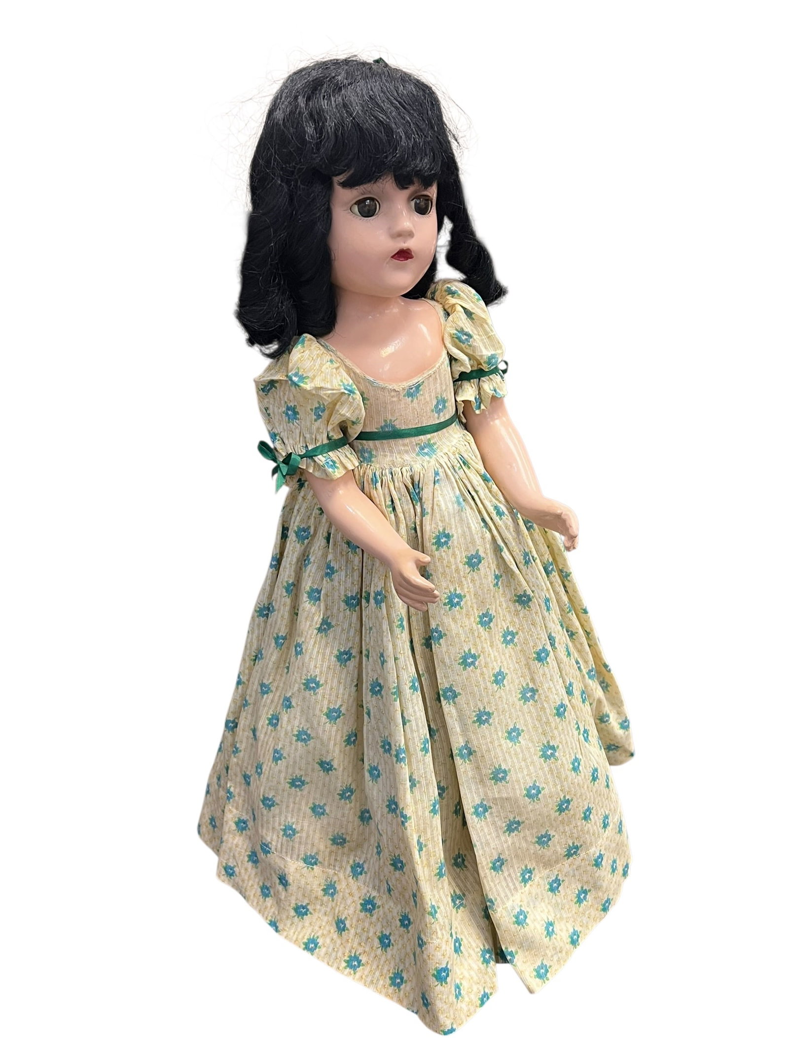Madame Alexander “Scarlett Ohara?? Doll: This image appears to show a vintage composition doll that closely resembles a Madame Alexander Scarlett O'Hara doll from the late 1930s or 1940s. [1, 2]Key FeaturesMaterial: Crafted from