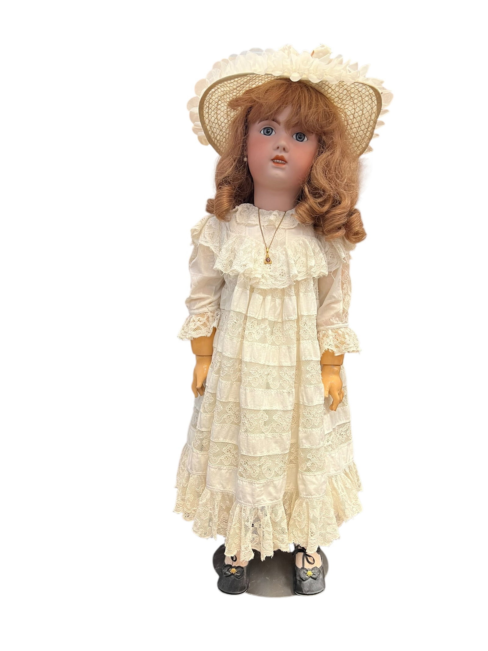1907 Bisque Head Doll: vintage or antique collectible porcelain doll outfitted in an intricate, Victorian-style costume.Doll Features & DetailsHead & Expression: The head features a bisque or porcelain finish with