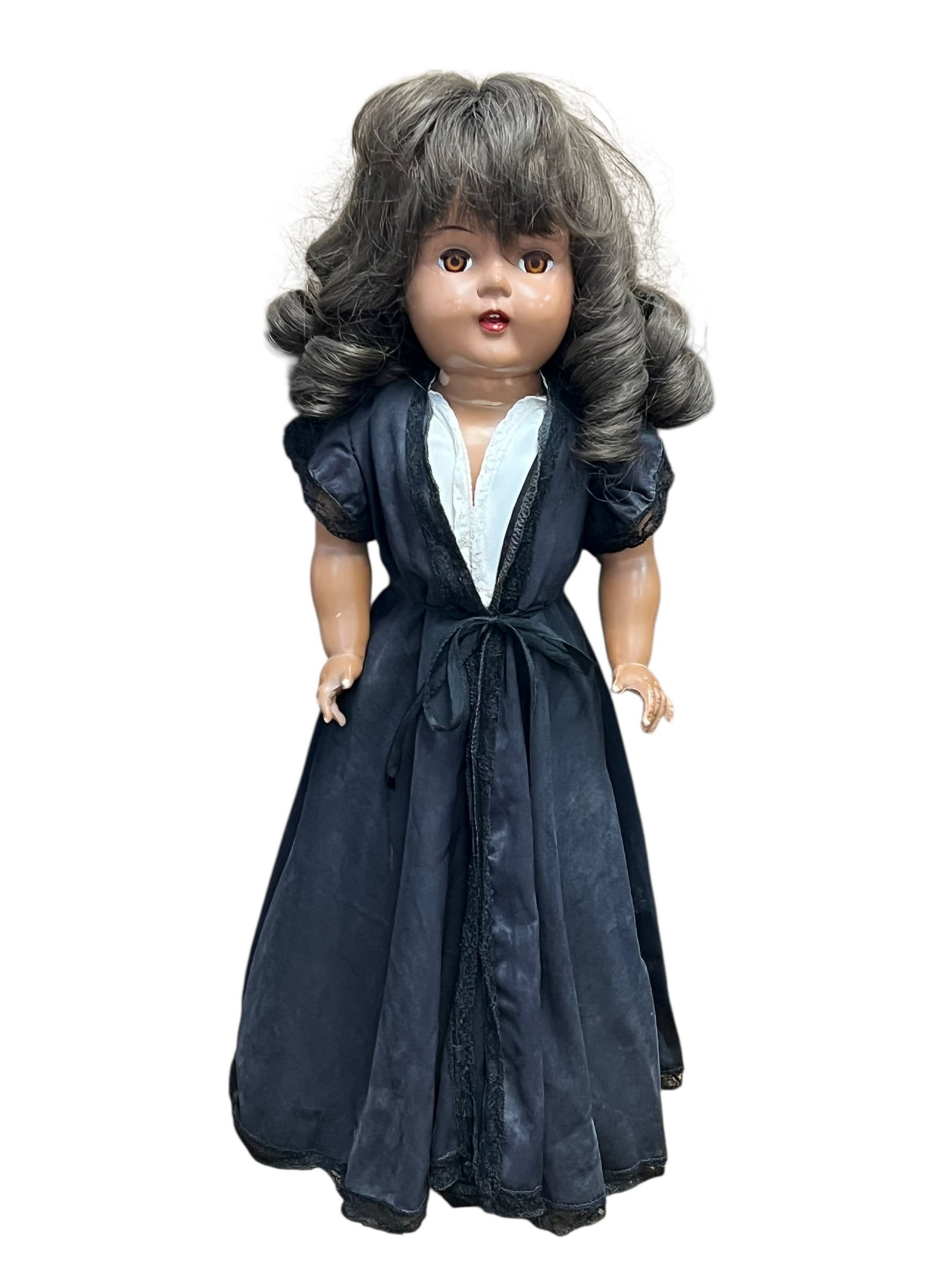 Plastic Doll: This is a vintage composition doll typically dating from the 1930s to the 1940s. Based on its features, it strongly resembles classic "Little Lady" or "Honey" series dolls produced by manufacturers