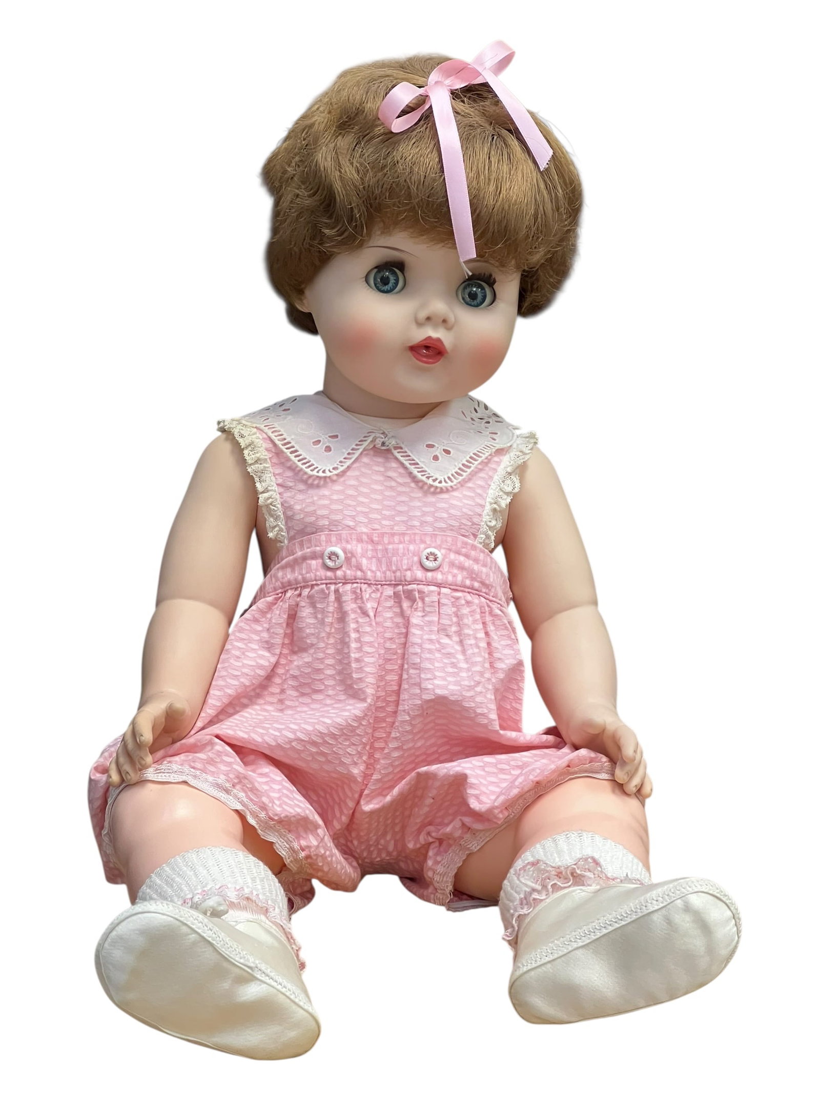Vinyl Talking Doll: vintage mid-20th-century toddler or baby doll, closely resembling styles like the 1950s "Toodles" dolls produced by the American Character Doll Company. [1, 2]Key FeaturesHair and Face: Short, curly