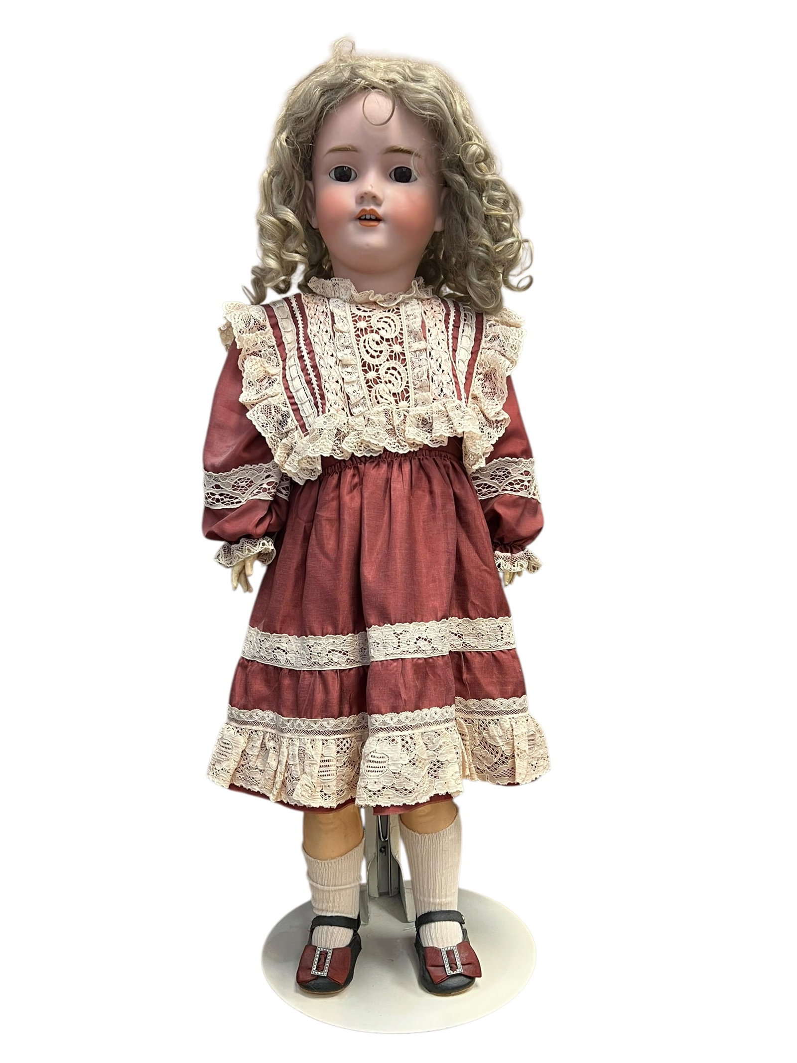 S&H Handwerck Germany Bisque Head Doll: This is a classic antique bisque socket-head doll, produced in Germany during the late 19th or early 20th century. [1, 2]Key Characteristics & FeaturesHead & Expression: The head is made of finely