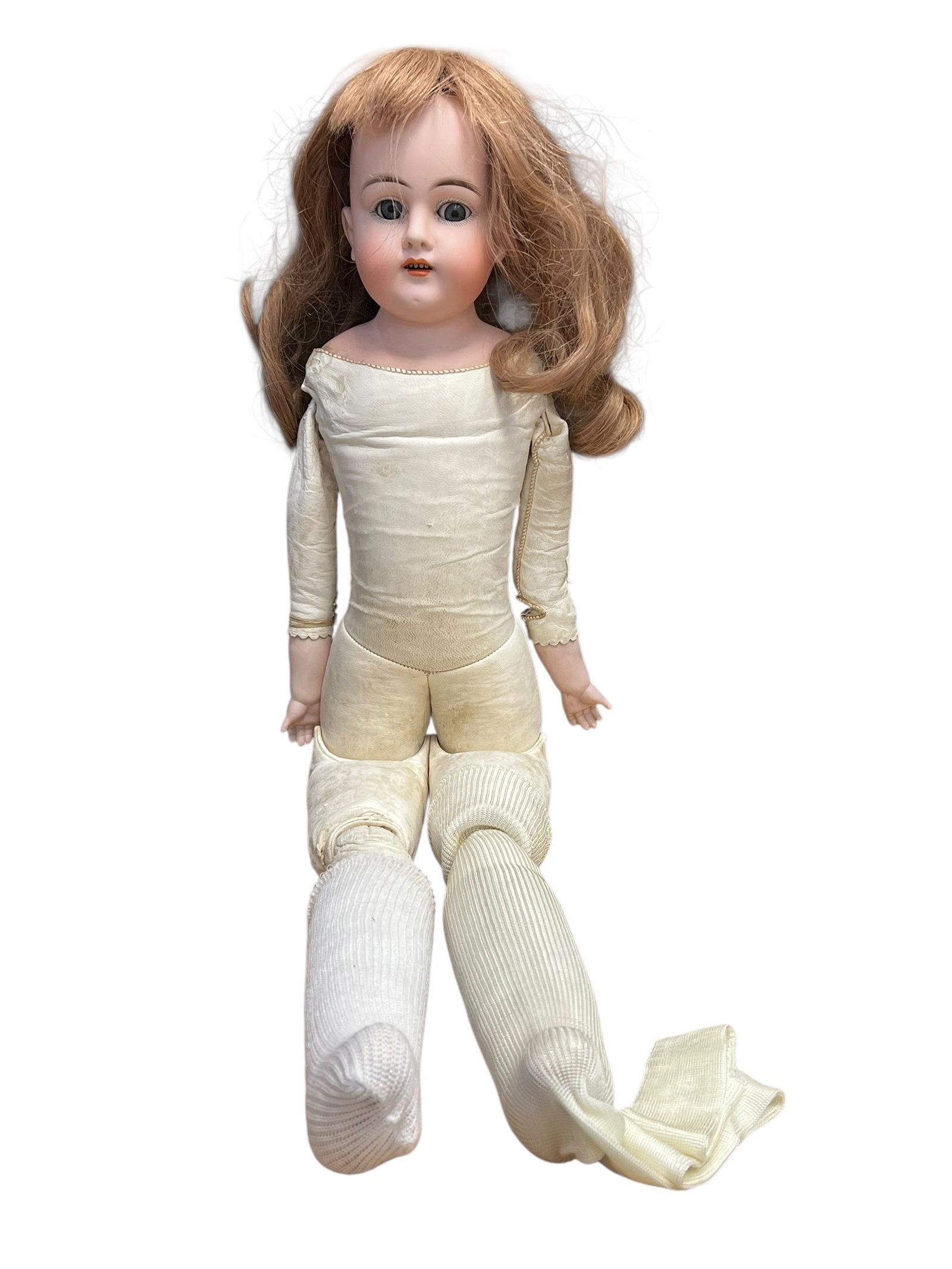 29 118 Bisque Head Doll: antique German bisque-head doll with a kid leather or cloth body, similar to styles produced around the late 19th or early 20th century. [1, 2]Head: Crafted from tinted bisque porcelain featuring