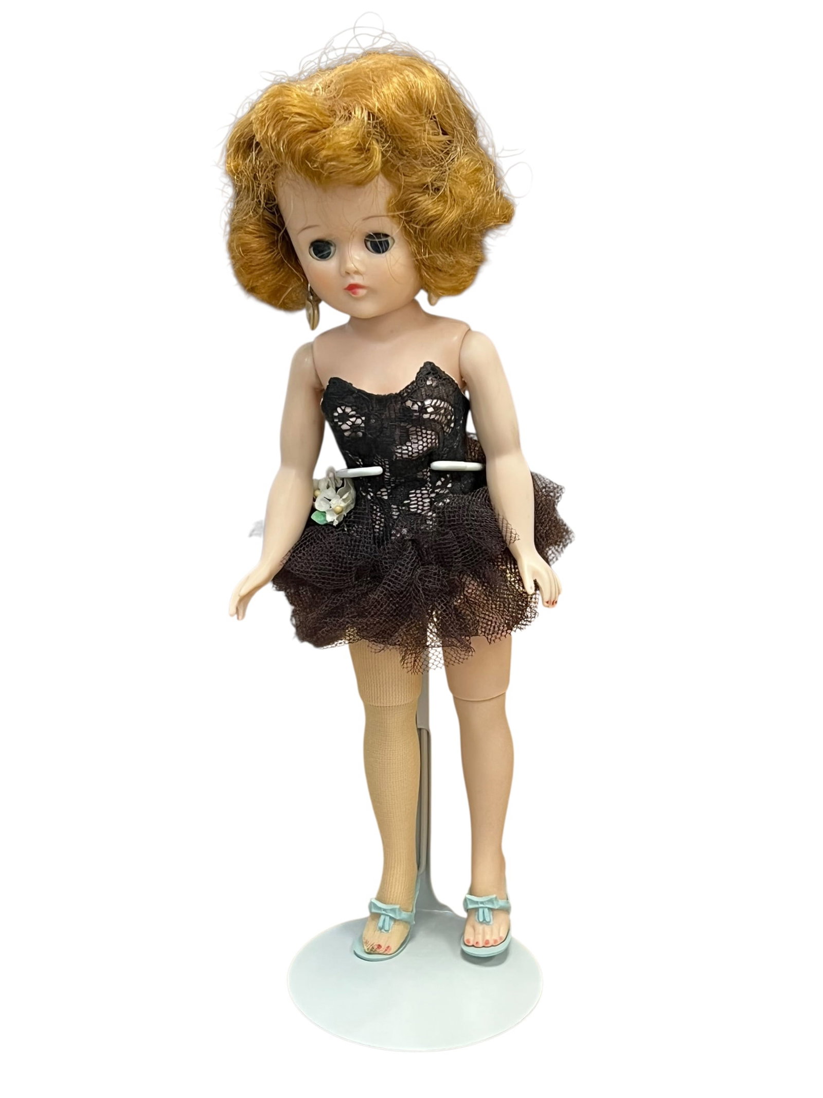 Vogue “Jill?? Plastic Doll: vintage Vogue Jill Doll from the 1950s, styled as a ballerina in a black lace and tulle outfit. [1, 2]OverviewType: Vintage hard-plastic or vinyl fashion doll (Jill by Vogue Dolls Inc.)Era: Circa 1950