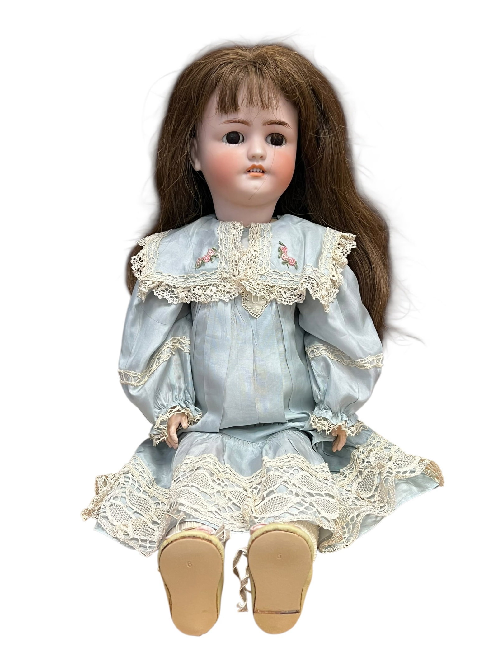 Germany S&H Bisque Head Doll: antique bisque doll, likely of late 19th or early 20th-century German manufacture. These collector items are highly sought after for their characteristic molded porcelain features. [1, 2, 3]Key