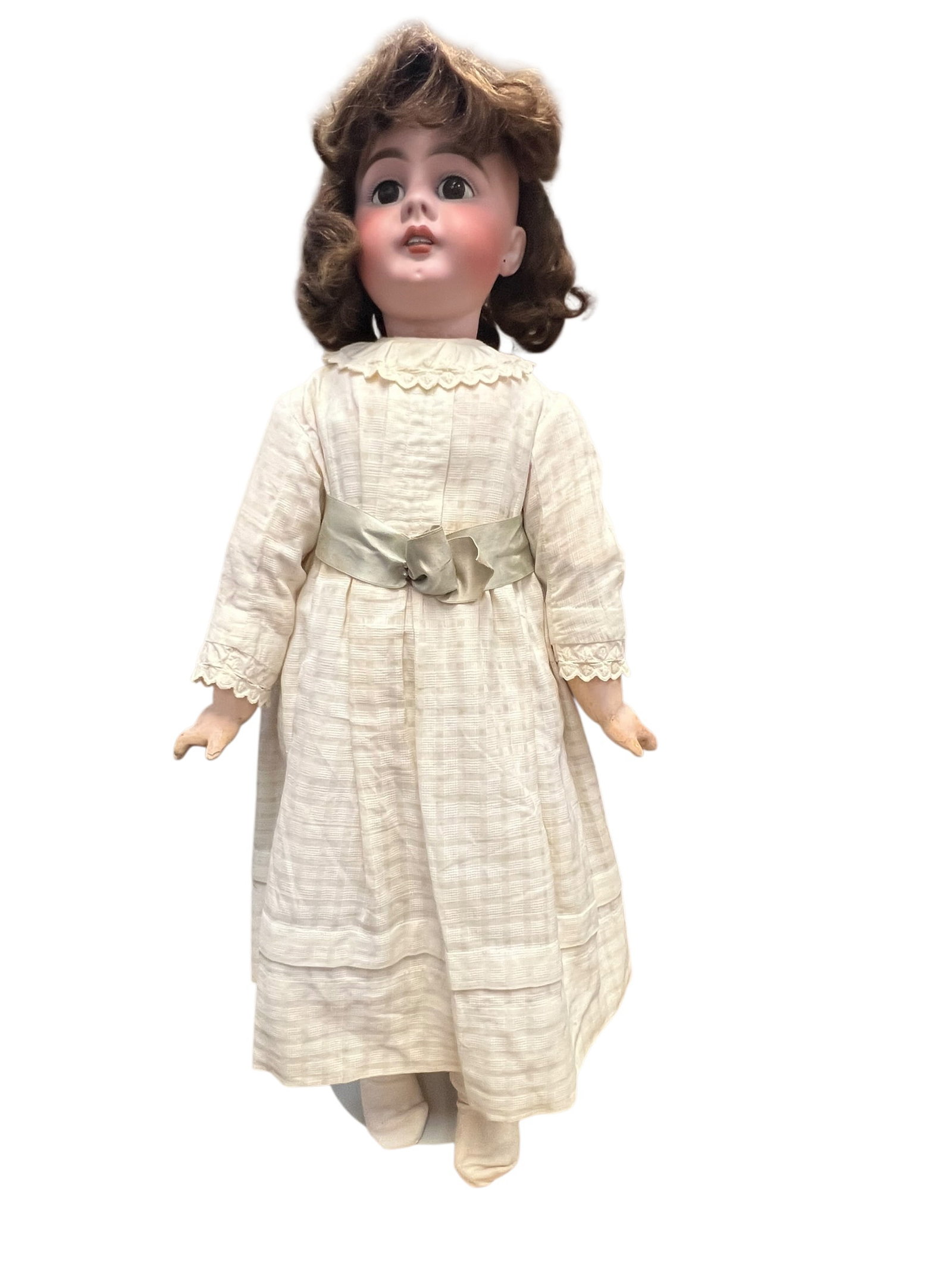 S&H 46 Bisque Head Doll: This image appears to show an antique German bisque-head doll, likely from the late 19th or early 20th century, dressed in a vintage light-colored dress. [1, 2]It features a pale bisque porcelain
