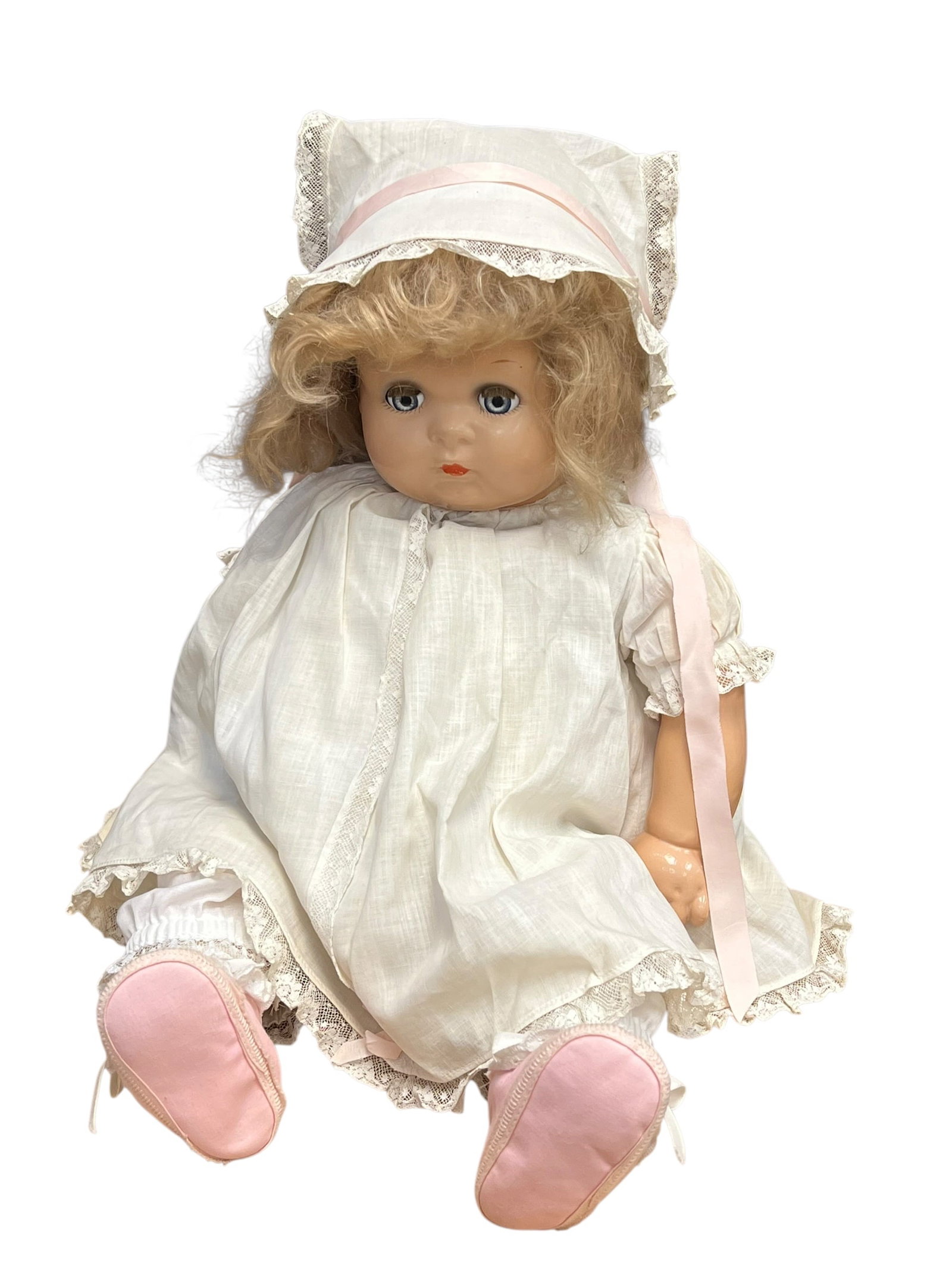 Baby Georgene Porcelain Head Doll: vintage baby or toddler doll from the mid-20th century, likely dating from the 1930s to 1950s. [1, 2]Key FeaturesFacial Expression: Features blue sleep eyes and painted facial details with a classic n