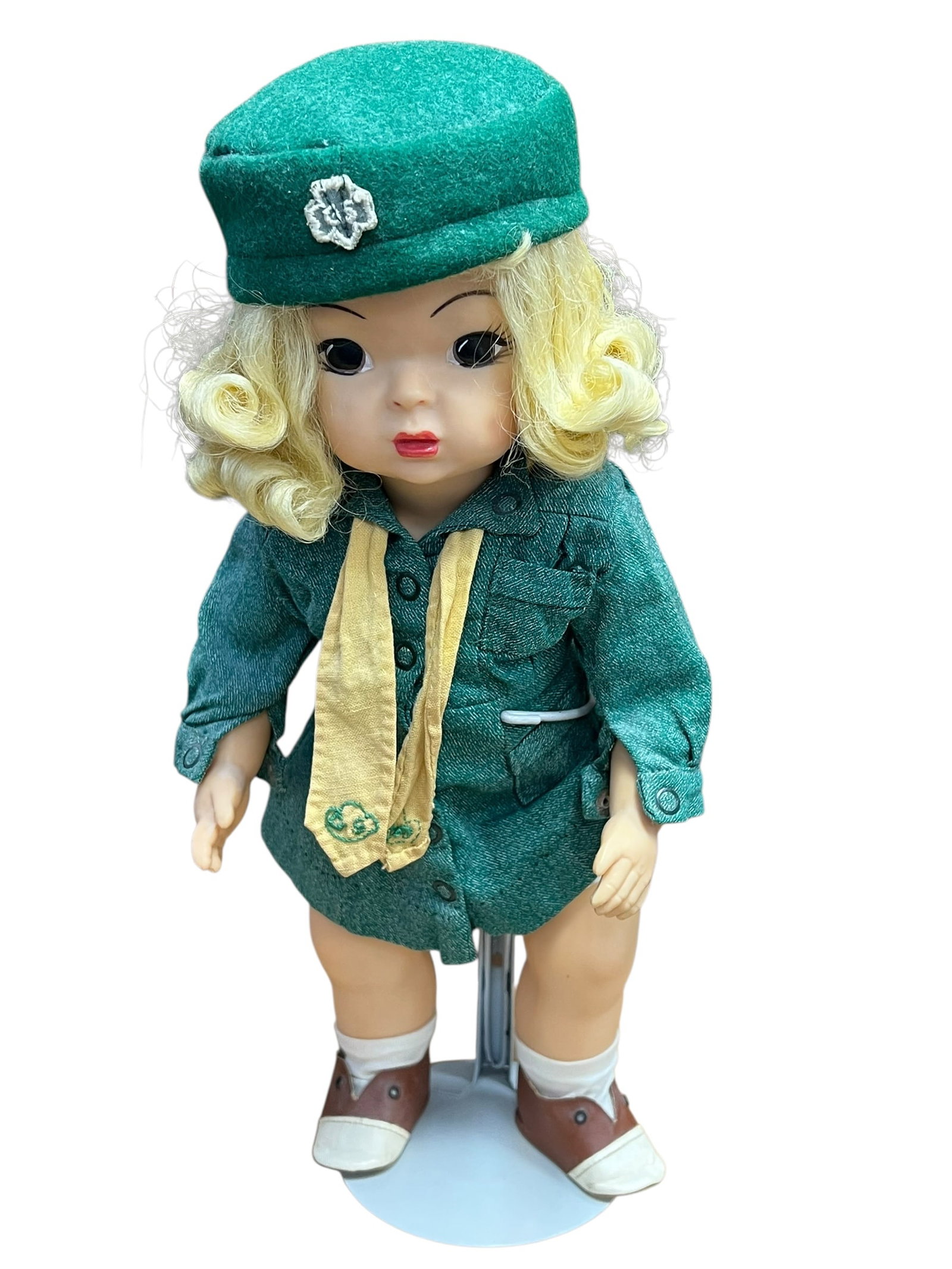 Girl Scout Doll: vintage 1950s Terri Lee Girl Scout doll, measuring approximately 16 inches tall. [1, 2]Key DetailsManufacturer: Terri Lee Doll CompanyEra: Circa 1950sOutfit: Green wool-blend Girl Scout uniform dress,