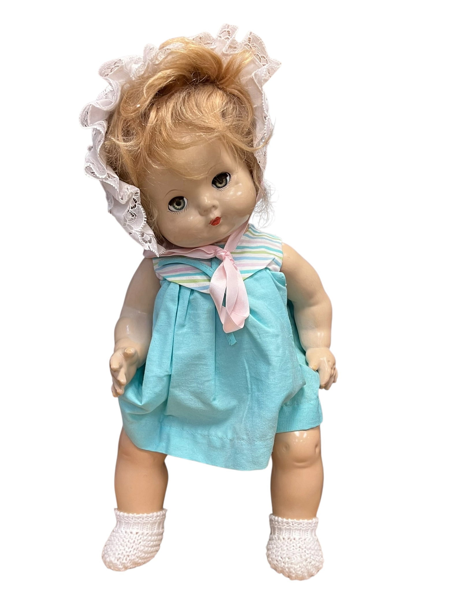 Effanbee Composition Doll: vintage vinyl baby doll likely dating from the mid-1950s to the 1960s, a period when drink-and-wet sleep-eye baby dolls became highly popular. It strongly resembles classic vinyl dolls made by compani
