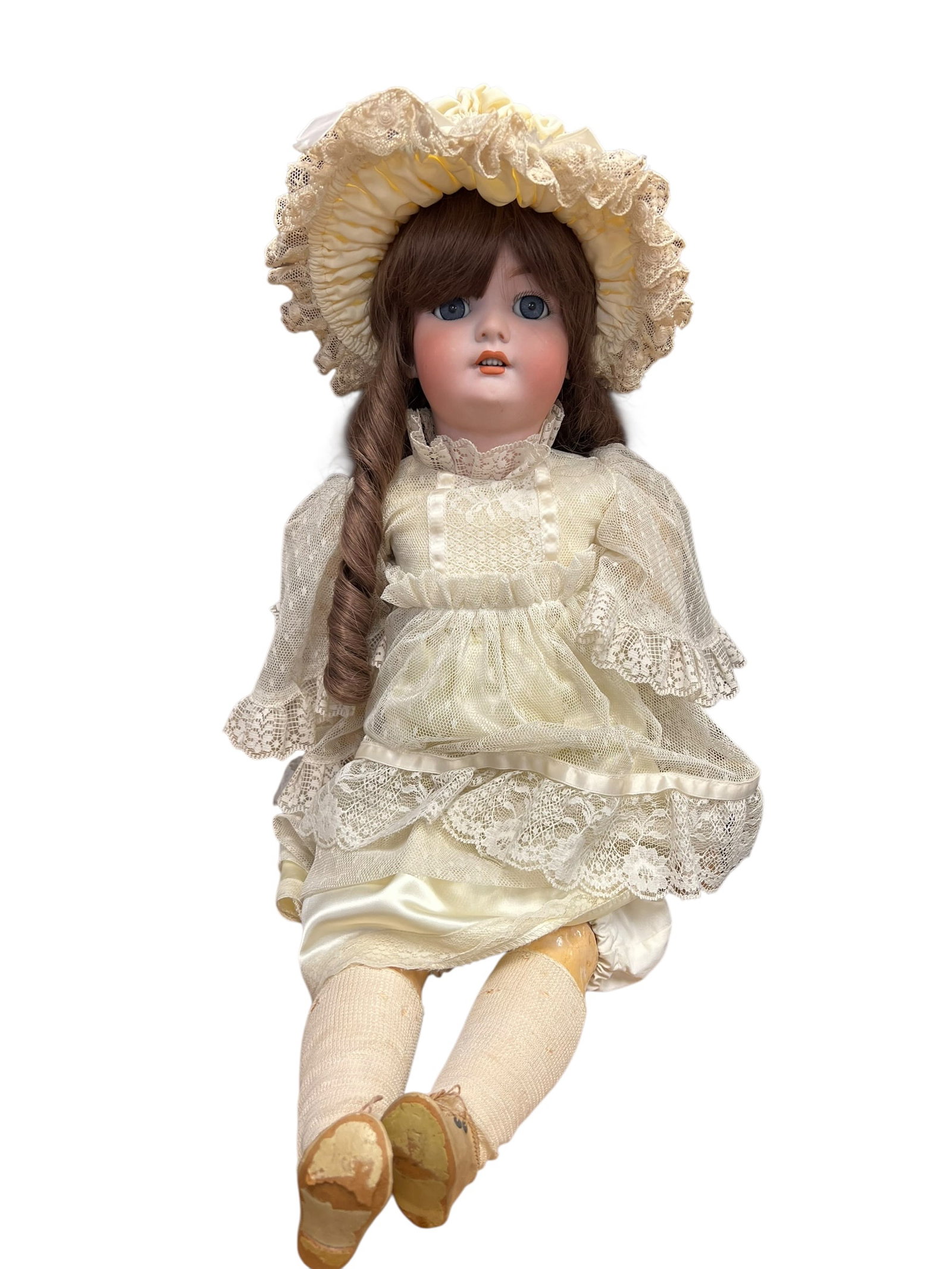 S&H Handwerck Germany Bisque Head Doll: This item appears to be an antique or vintage bisque-head doll wearing a cream-colored lace dress and a matching ruffled bonnet. [1, 2]Key FeaturesHead: Made of smooth bisque porcelain with painted fa