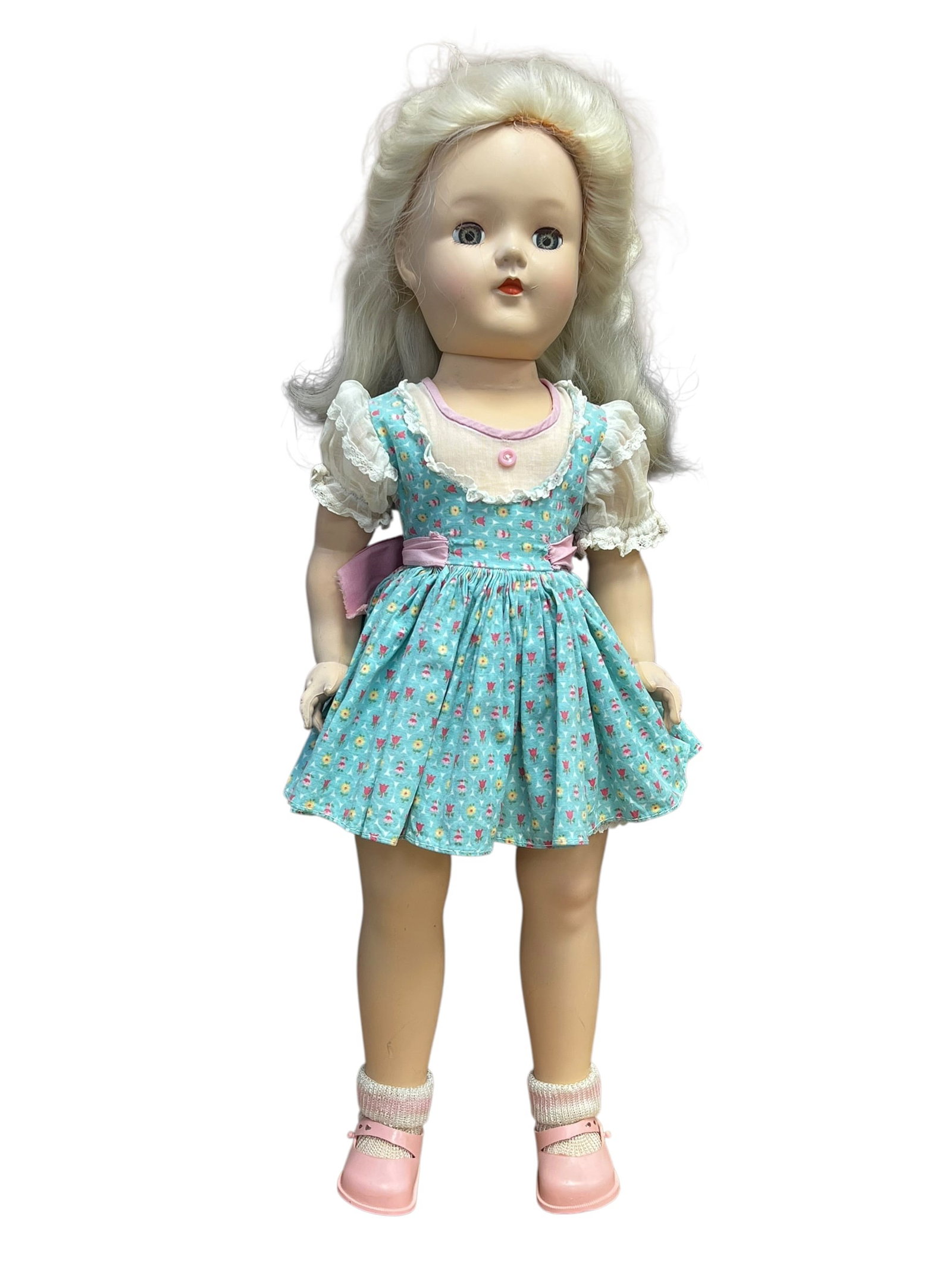 Ideal Vinyl Doll: vintage hard plastic Toni doll manufactured by the Ideal Toy Company during the late 1940s to 1950s. [1, 2]Key Features of this DollIdentity: This is the iconic Toni Doll, originally marketed alongsid