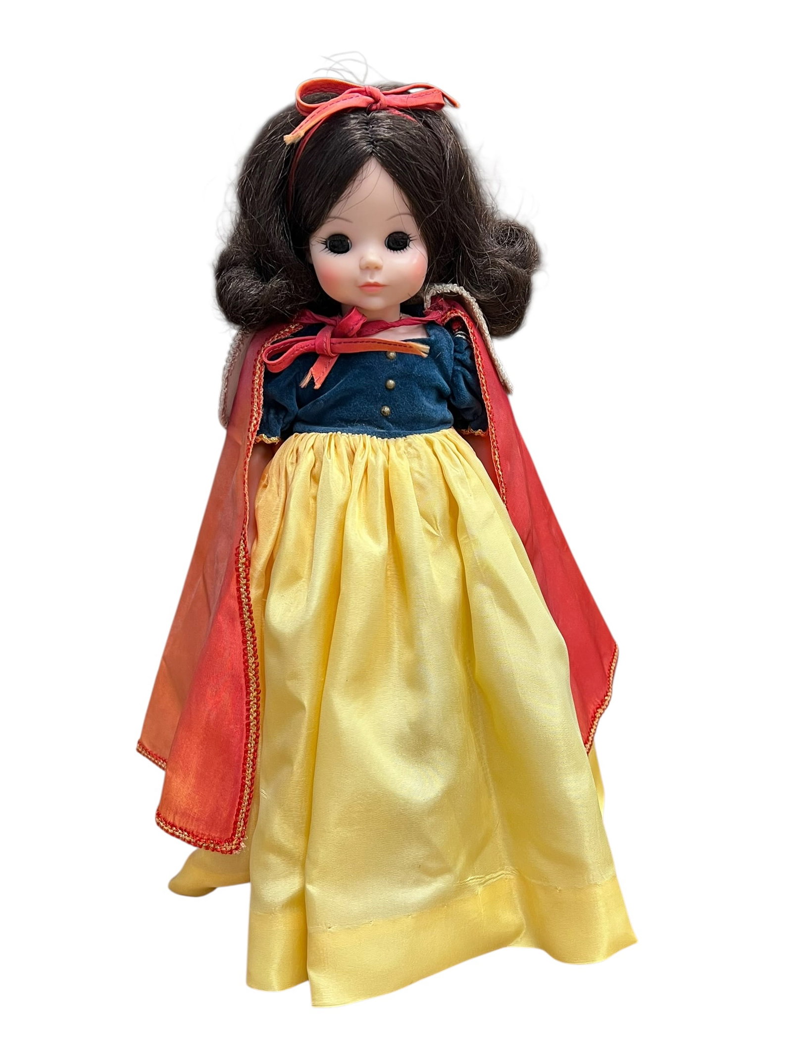 Madame Alexander “Snow White?? Doll: This appears to be a vintage Snow White collector doll, possibly resembling older Madame Alexander or Effanbee Storybook editions with a dark curly wig, blue velvet bodice, yellow satin skirt, and