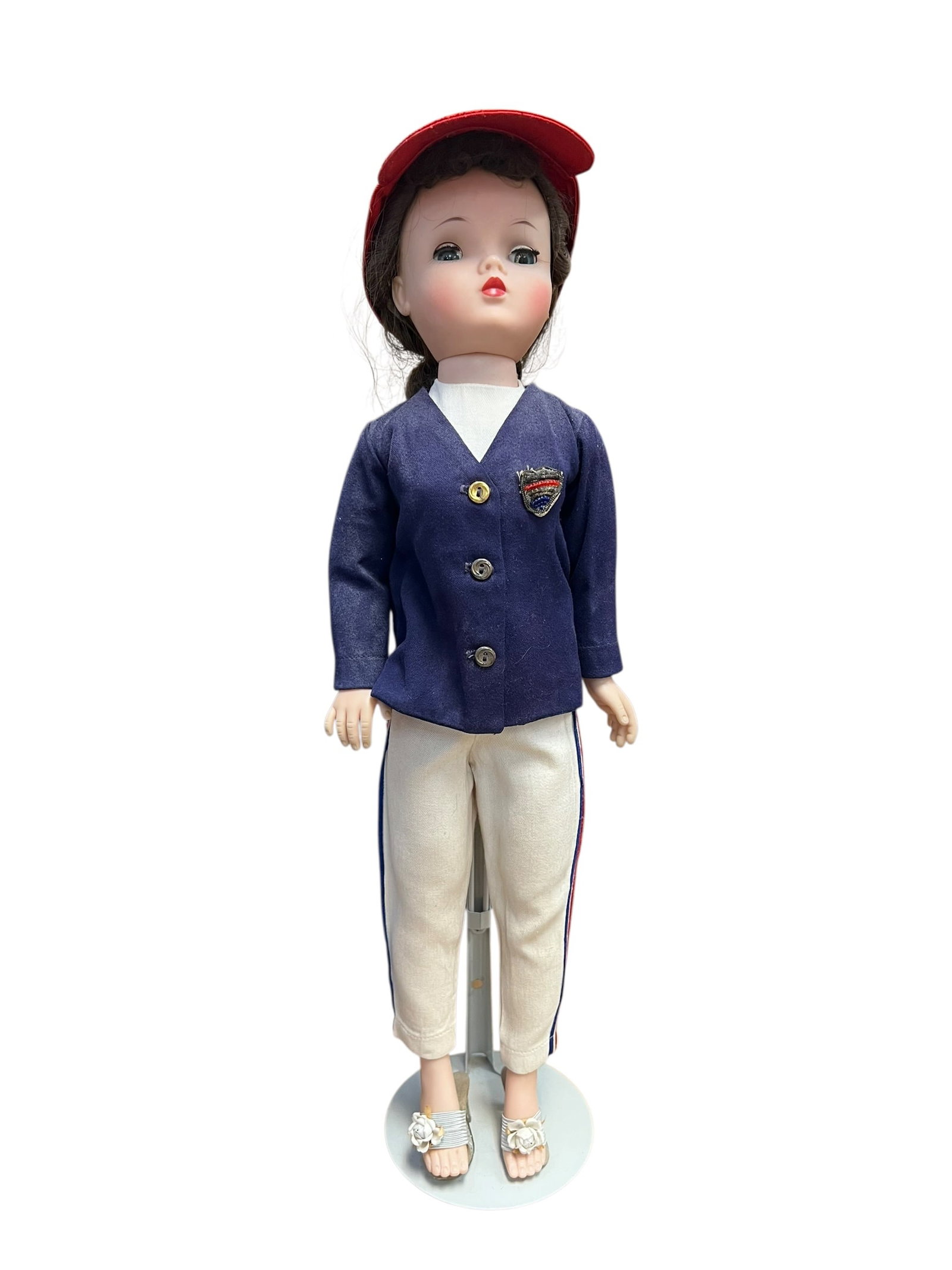 Alexander Doll: This image appears to show a vintage Madame Alexander Cissy doll from 1958, dressed in a collectible yachting ensemble