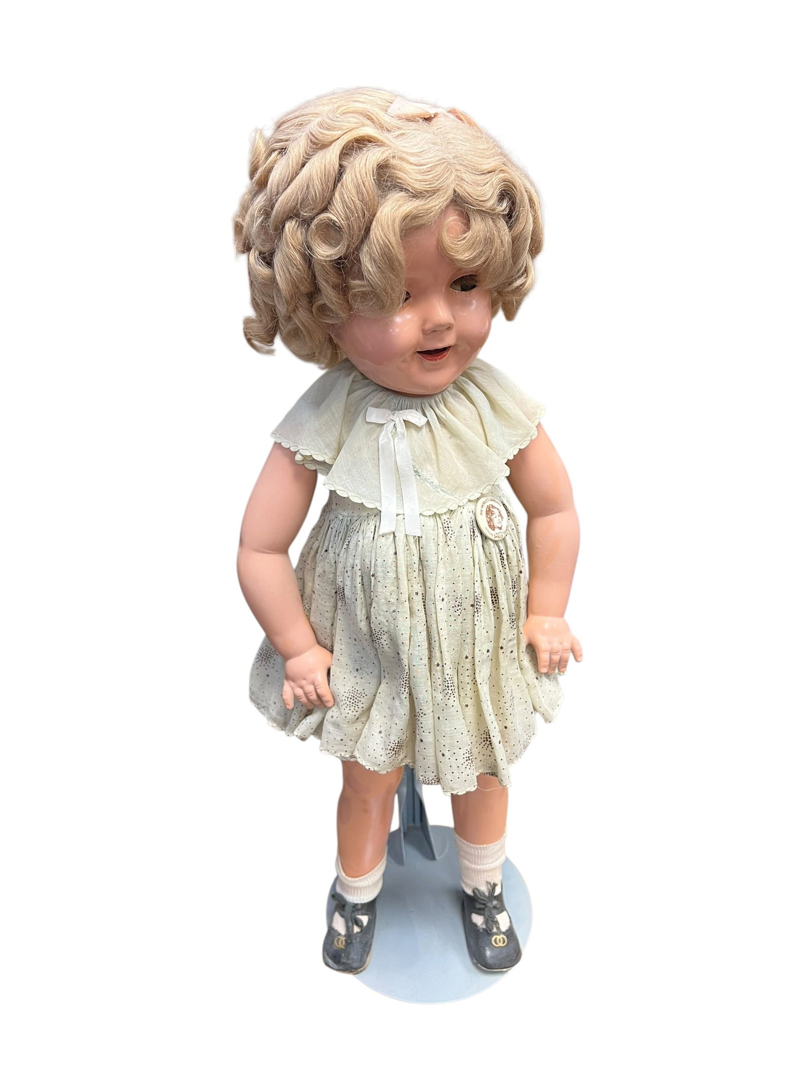 Shirley Temple Doll: vintage 1930s Ideal Shirley Temple composition doll, likely featuring her original mohair wig and dress. [1, 2, 3]Key FeaturesComposition Body: Crafted from a molded mixture of wood pulp, glue, and