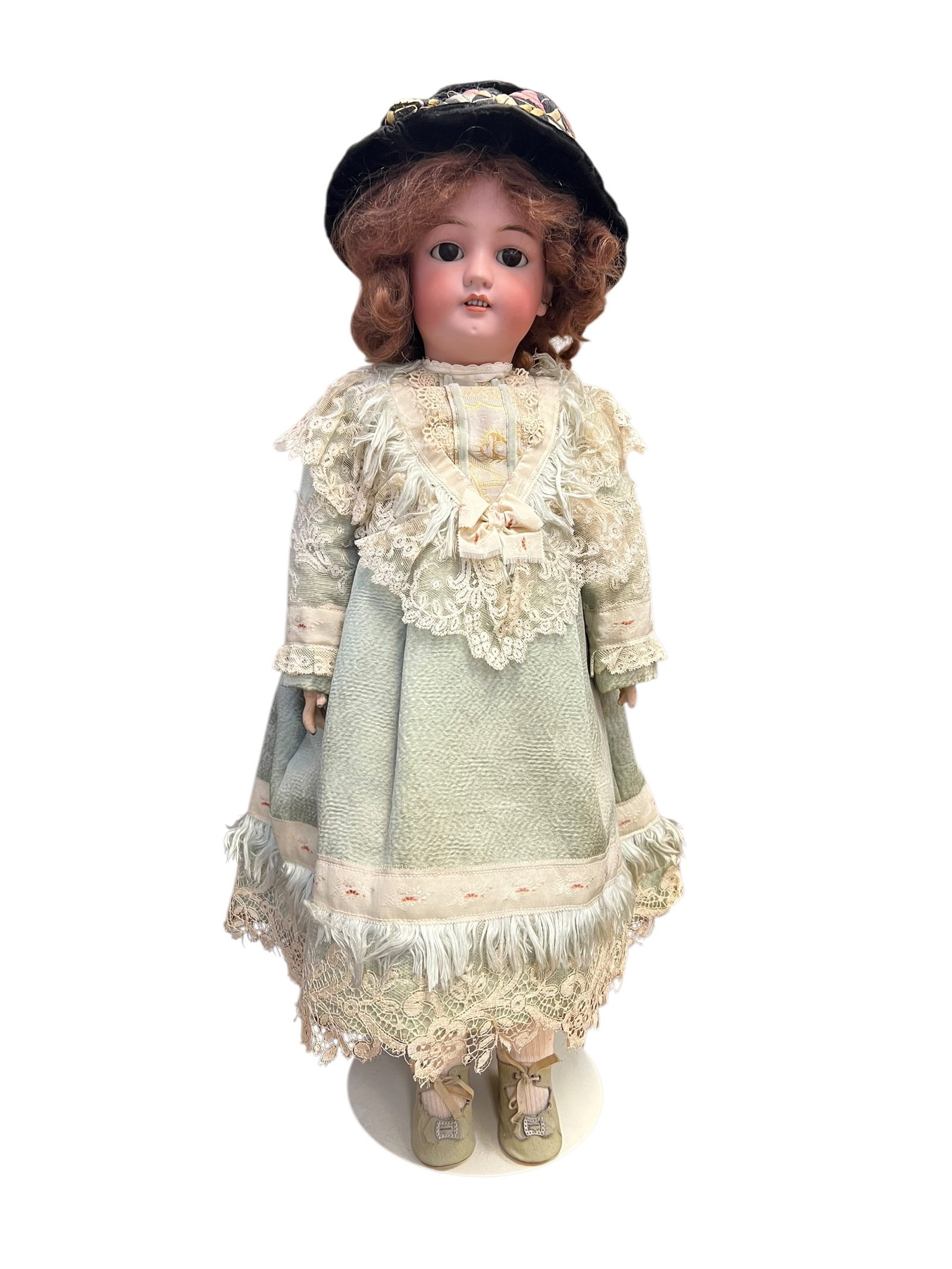 S&H 1349 Bisque Head Doll: antique bisque doll, highly characteristic of late 19th-century to early 20th-century craftsmanship.Key CharacteristicsHead: Modeled with a tinted bisque porcelain socket head, featuring glass paperwe