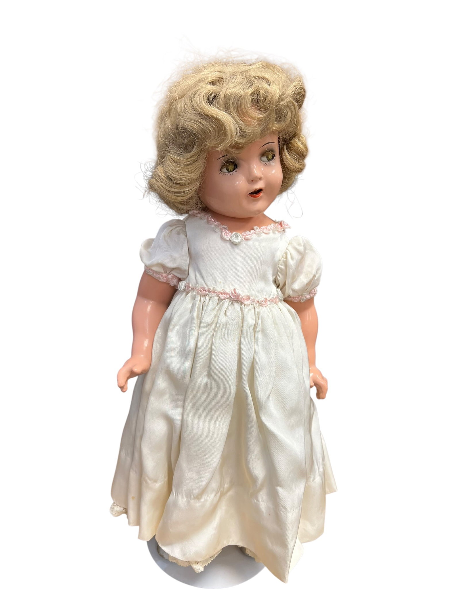 Shirley Temple 18 Doll: This image appears to show a vintage composition doll from the 1930s, closely resembling a Shirley Temple-style doll or a similar contemporary collectible. [1, 2]Key FeaturesMaterial: Crafted from