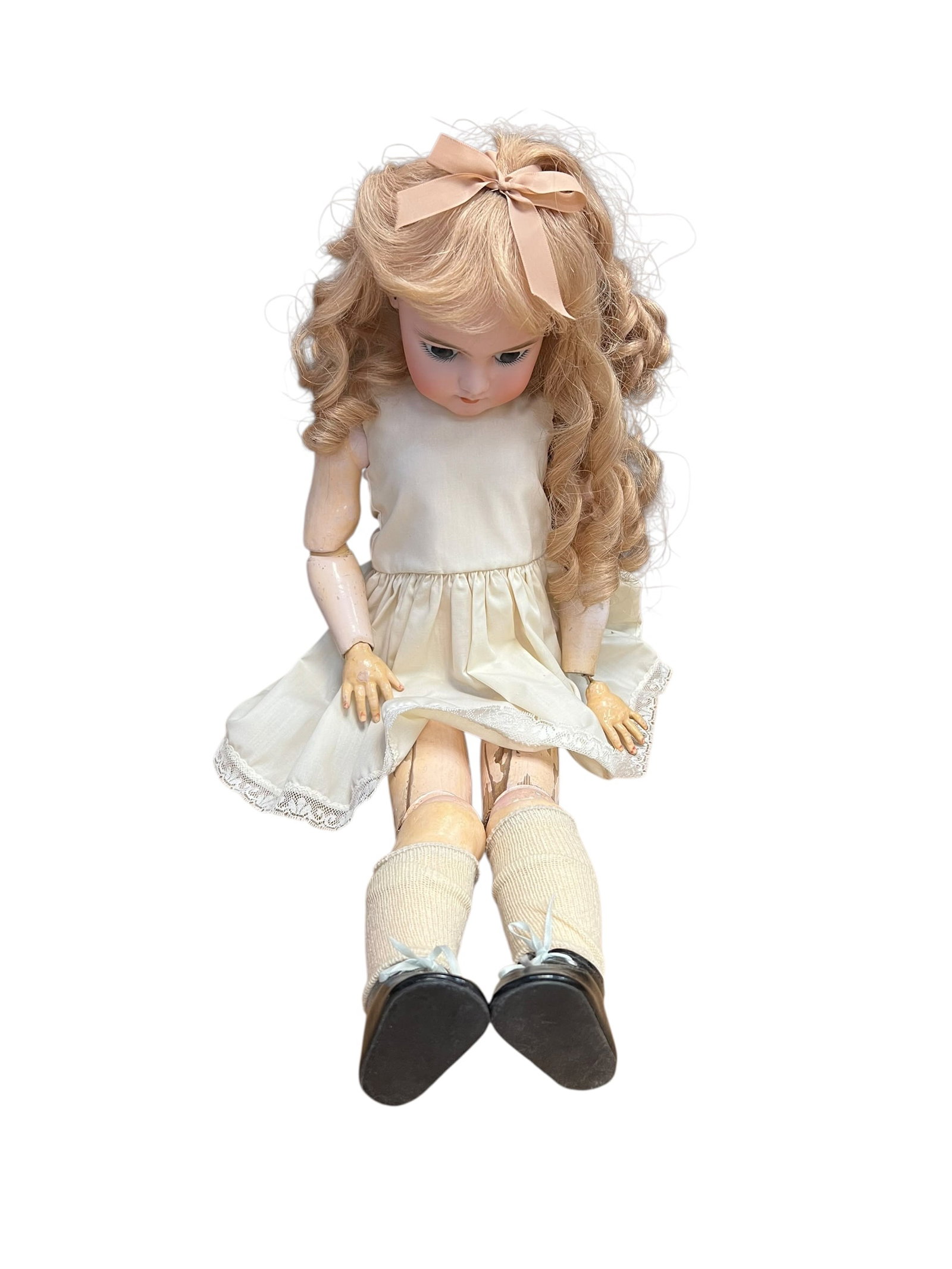 S&H DEP Bisque Head Doll: vintage bisque-head doll attached to a classic jointed composition body. The doll showcases distinctive antique craftsmanship, including a delicate hand-painted face, inset glass eyes, a curly blonde