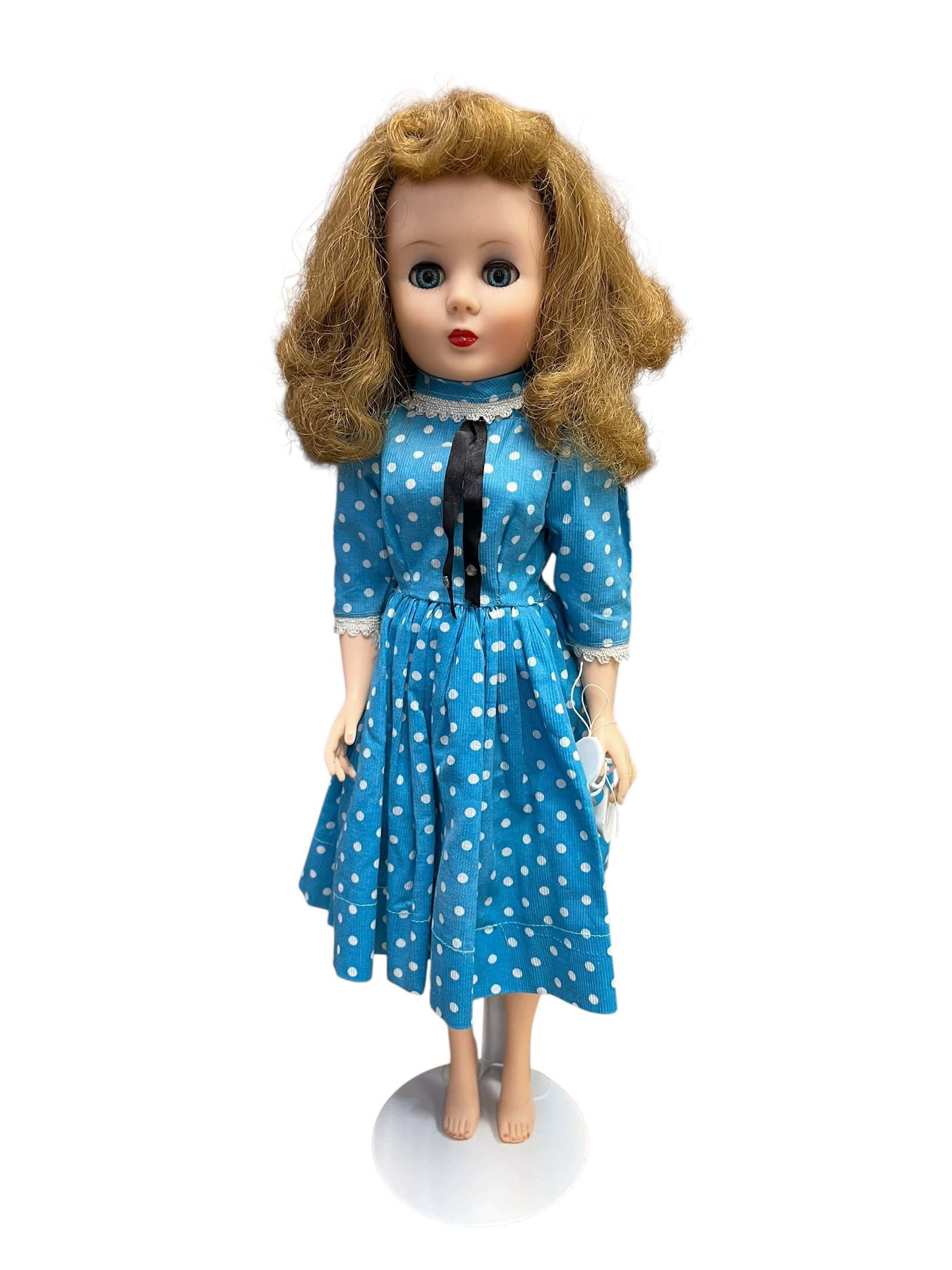 American Character Vinyl Doll: This vintage vinyl fashion doll shares distinct characteristics with highly collectible 1950s fashion dolls such as the Miss Revlon line by the Ideal Toy Company or similar mid-century walkers and deb