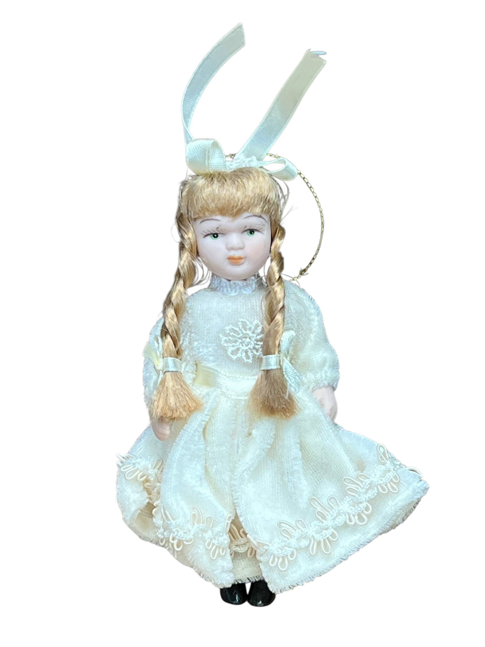 Bisque Head Doll Christmas Tree Ornament: miniature porcelain doll Christmas ornament. The doll features curly auburn or brown hair tied back with a white satin ribbon bow, painted facial features with blue or green eyes, and a full-length