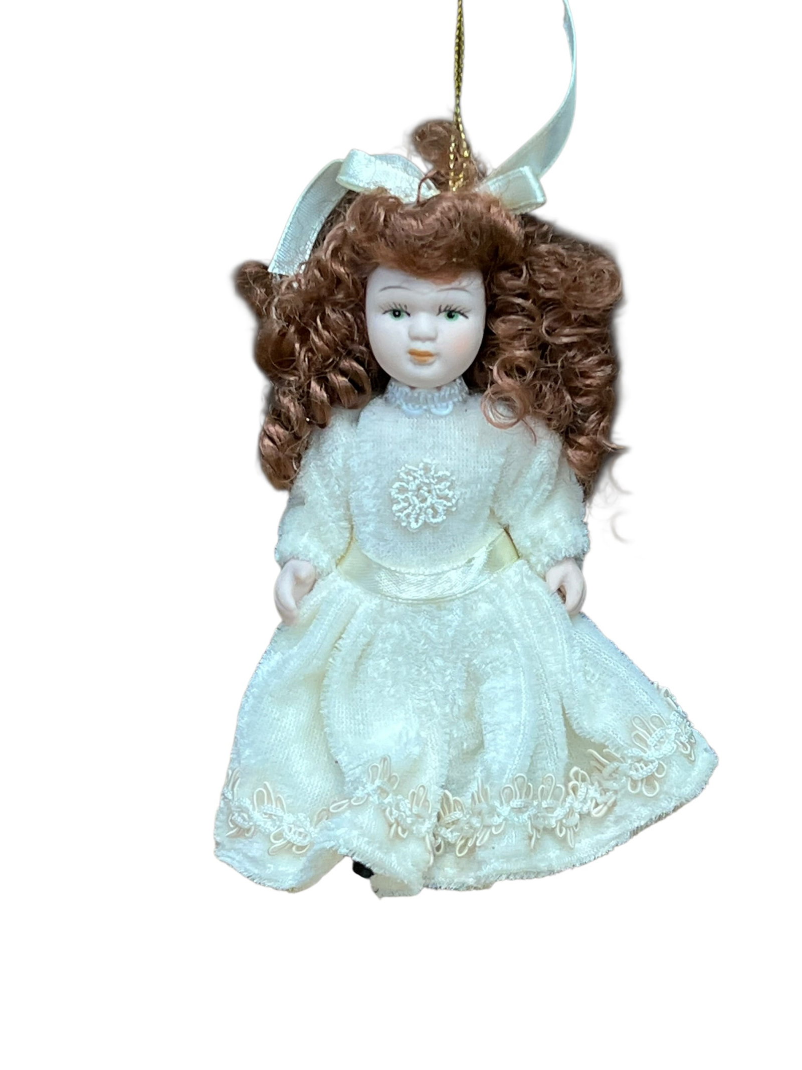 Bisque Head Doll Christmas Tree Ornament: miniature porcelain doll Christmas ornament. The doll features curly auburn or brown hair tied back with a white satin ribbon bow, painted facial features with blue or green eyes, and a full-length