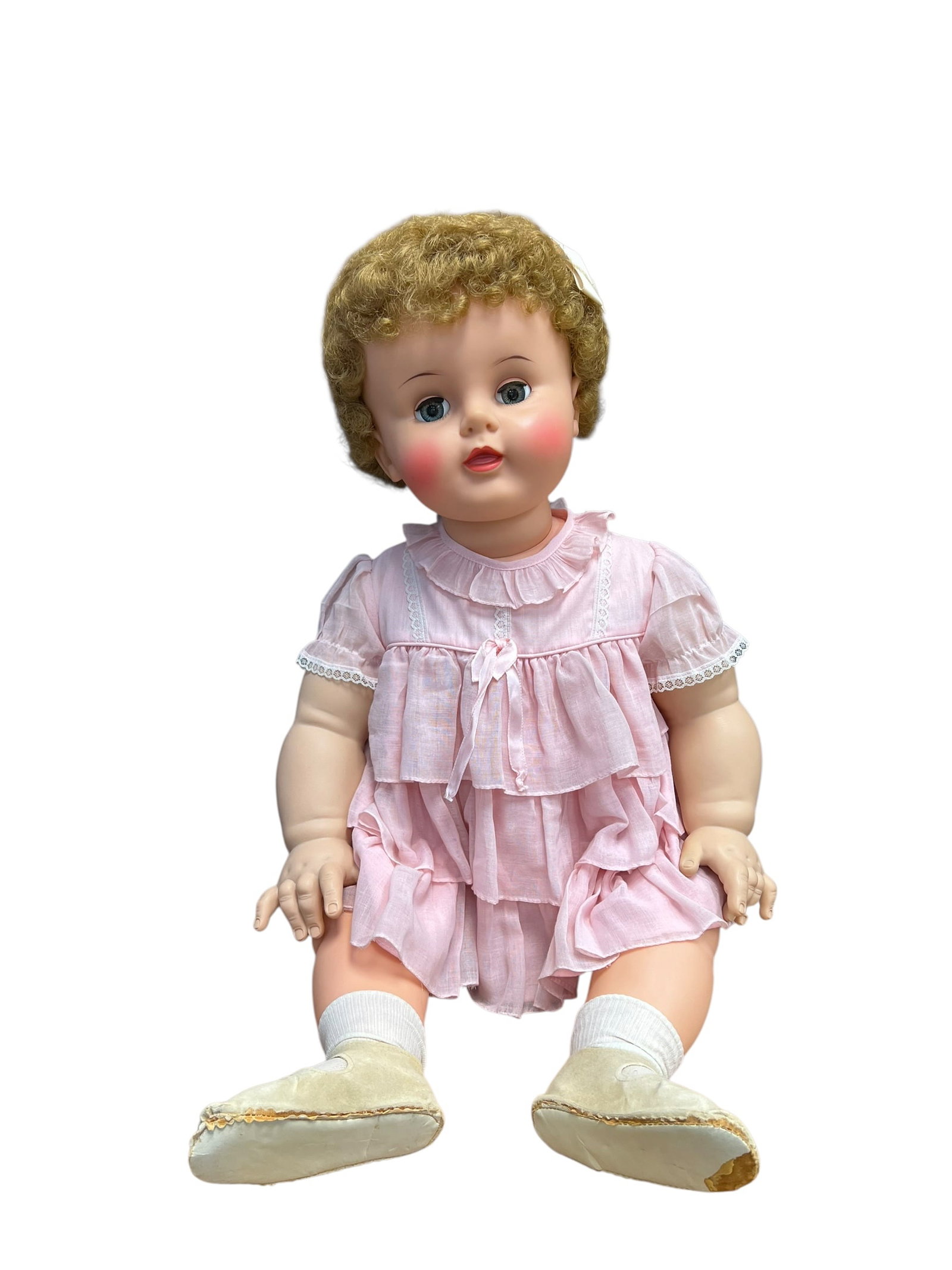 Ideal Vinyl Doll: This doll appears to be a vintage Suzy Playpal doll manufactured by the Ideal Toy Company in the late 1950s or early 1960s. [1, 2]Key CharacteristicsIdentity: She is known as the "chubby" younger