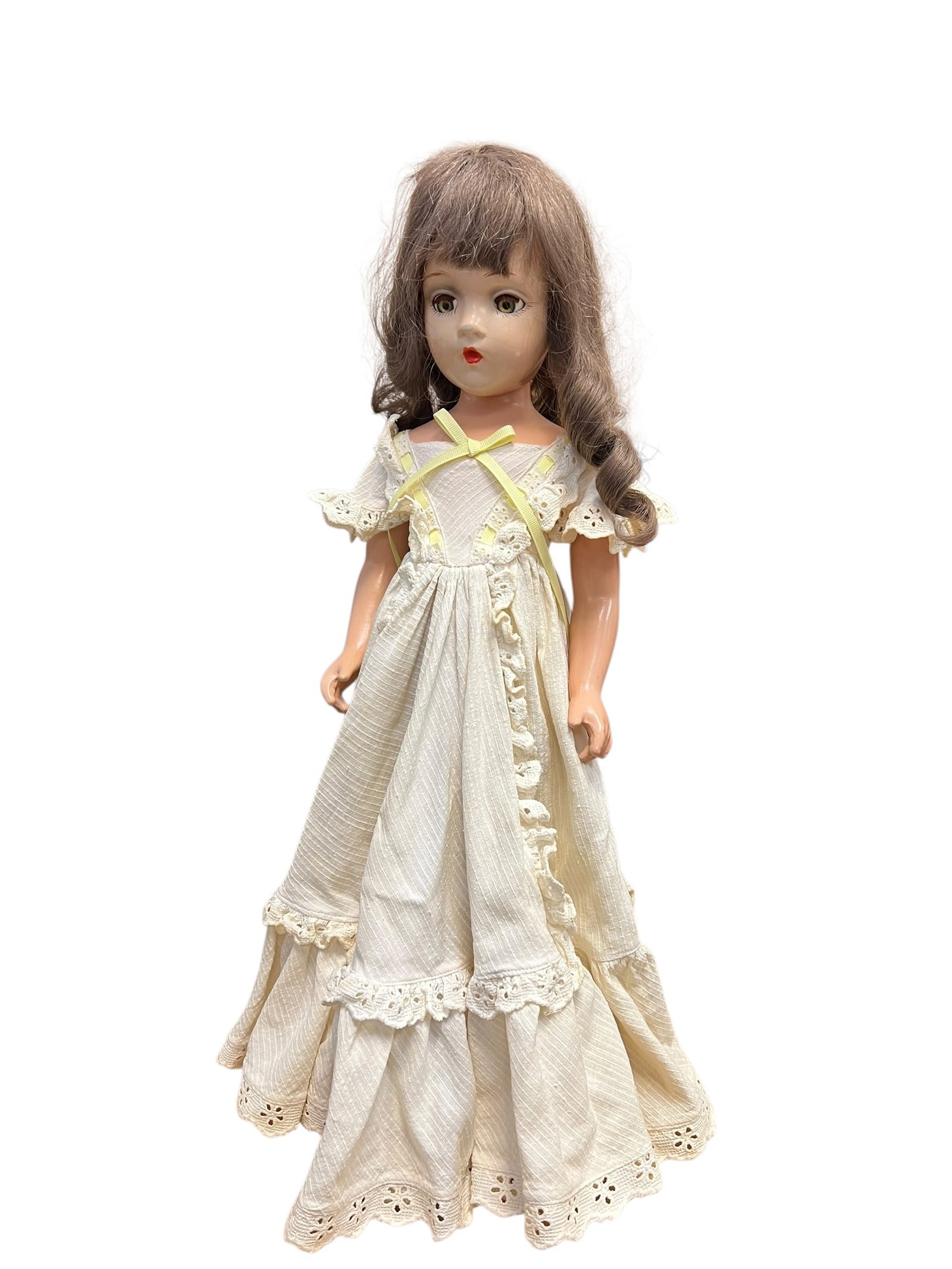 Madame Alexander Style Composition Doll: This image shows a vintage hard plastic walker doll from the mid-20th century (circa 1950s). The doll features long, wavy brown hair with bangs, painted facial details including bright red lips, and
