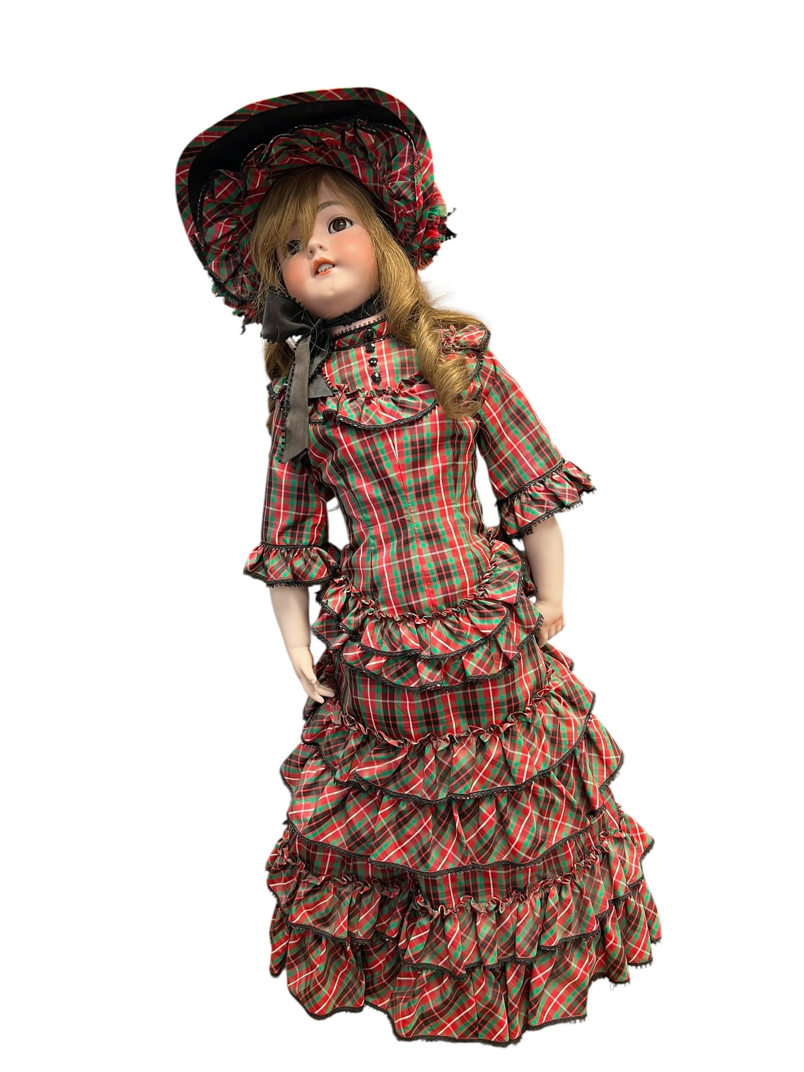 1248 Germany S&H Porcelain Doll: This antique bisque doll showcases a classically sculpted porcelain head, delicate painted facial features, and molded hands. She is dressed in an elaborately tiered Victorian-style red and green