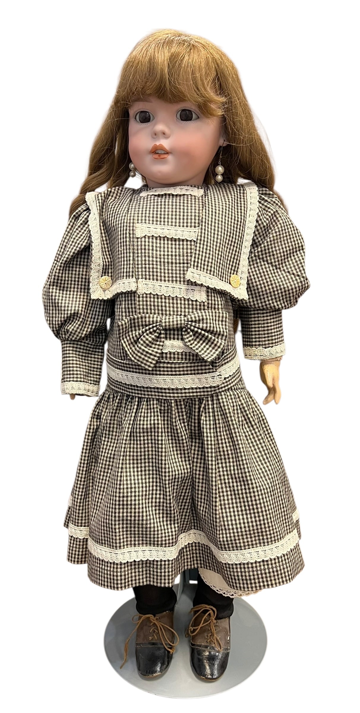 S&H 1279 DEP Germany 13 1/2 Porcelain Doll: antique bisque or porcelain doll dressed in a brown and white checkered gingham sailor-style dress with white lace trim, a matching wide collar, and lace-up vintage boots.