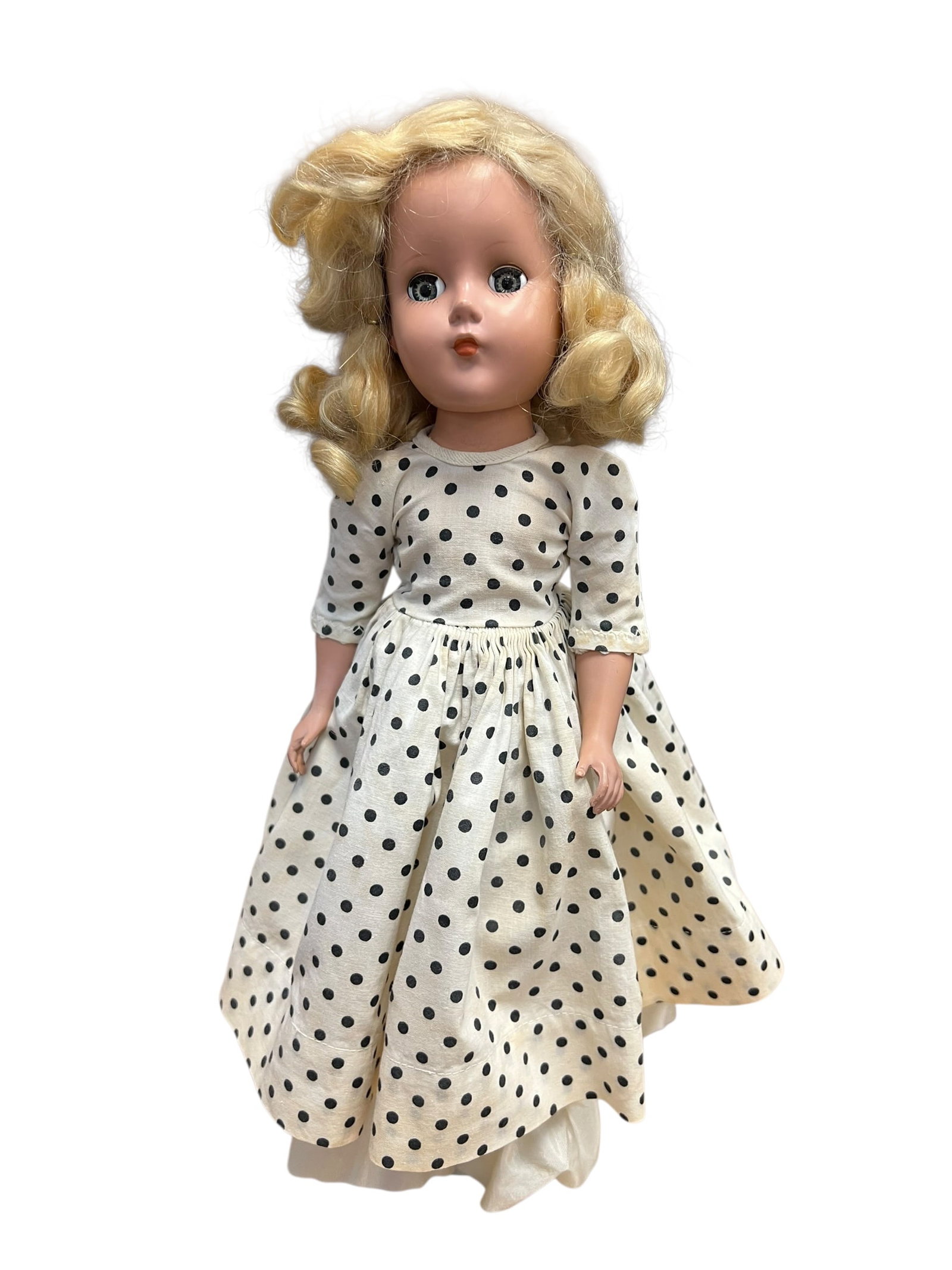 R&B Plastic Doll: This appears to be a vintage 1950s hard plastic doll, closely resembling the popular Ideal Toni doll or a similar fashion doll from that era (such as models by Madame Alexander or Horsman). [1, 2]Key
