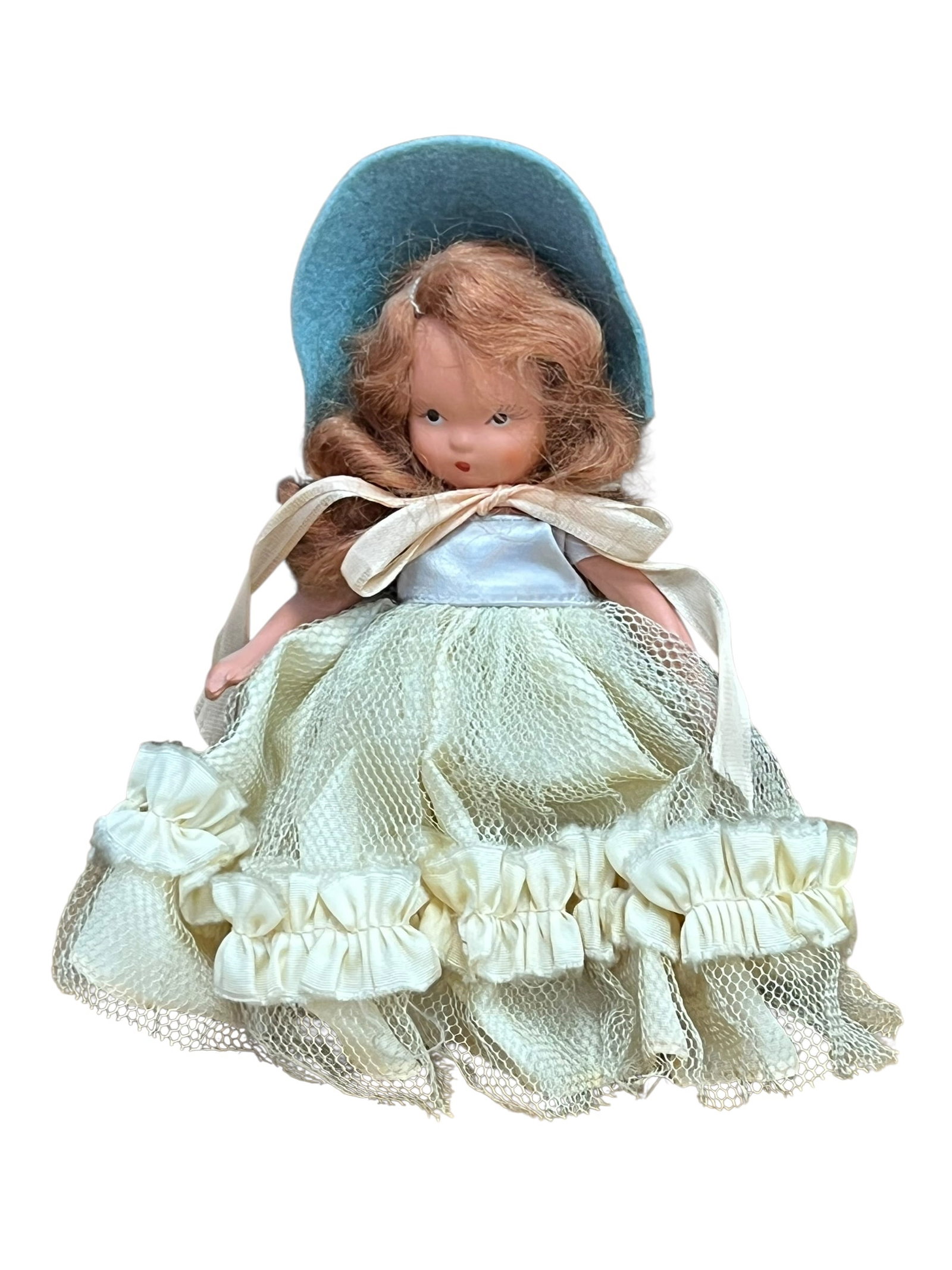 Nancy Ann Porcelain Doll: This appears to be a vintage Nancy Ann Storybook Doll, likely representing a character like Elsie Marley (#131), featuring bisque or porcelain-like construction with painted facial features, reddish-b