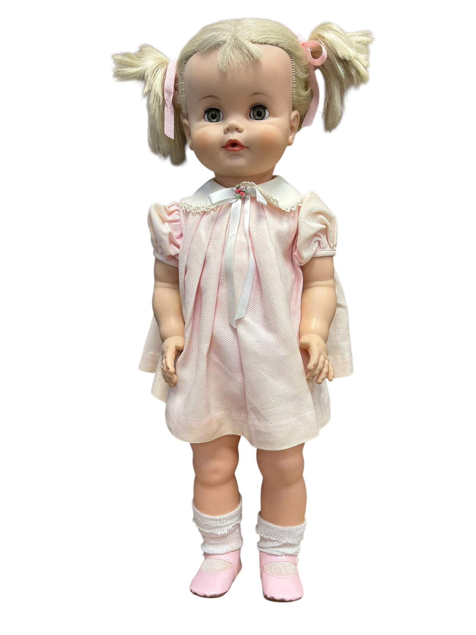 Madame Alexander Vinyl Doll: vintage 1961 Madame Alexander "Chatterbox" doll. [1, 2]This collectible doll stands approximately 24 inches tall and is constructed from a combination of hard plastic and vinyl. It is highly