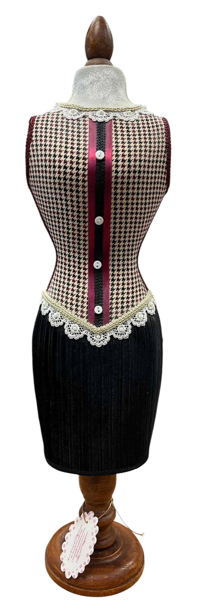 Decorative Victorian-Style Dress Form Mannequin on Turned Wood Stand: Decorative Victorian-inspired dress form/mannequin featuring an hourglass-shaped torso upholstered in burgundy, cream, and black houndstooth fabric. Detailed with burgundy and black vertical ribbon tr