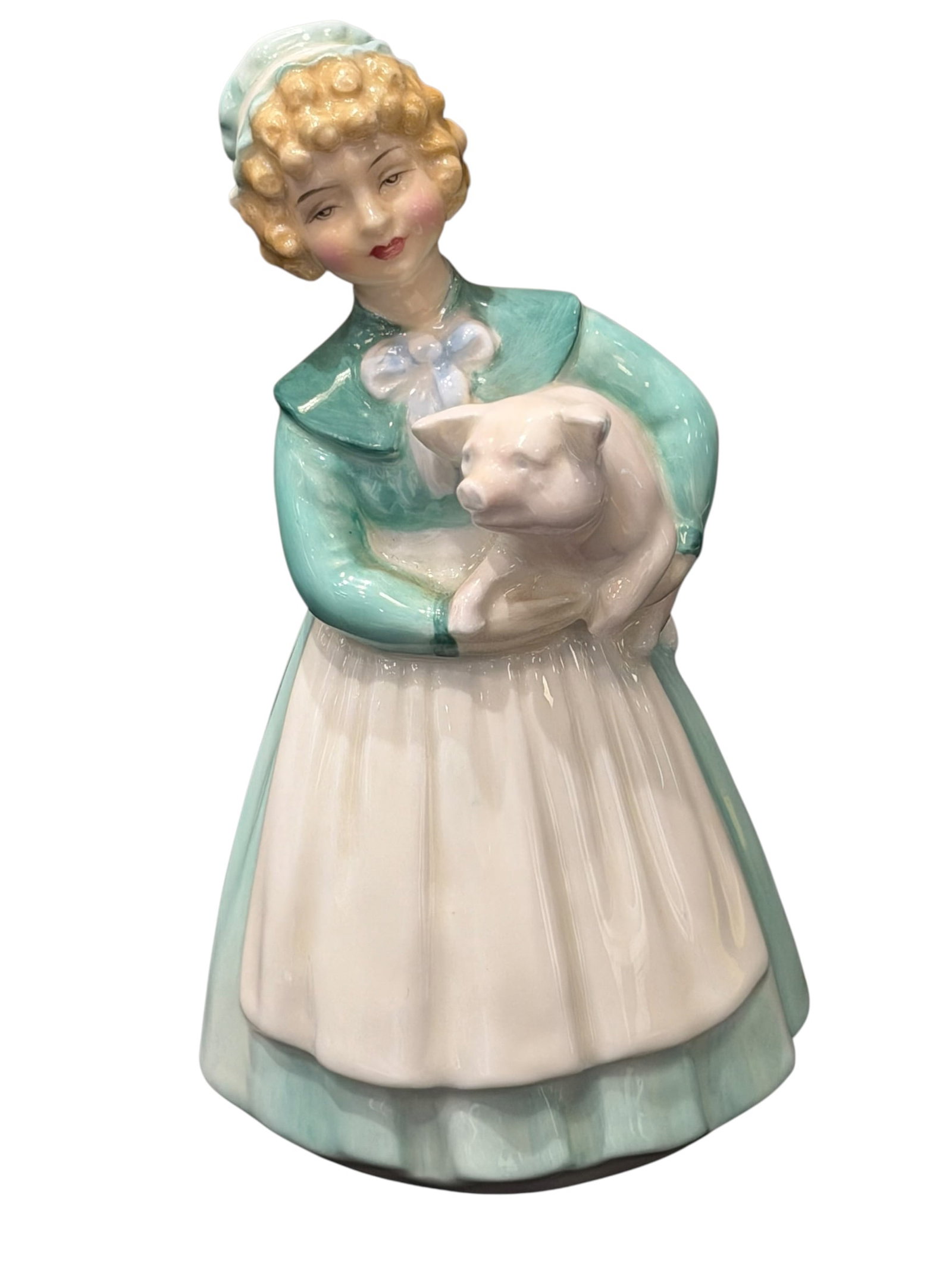 Royal Doulton “Stayed at Home?? Porcelain Figurine: Vintage Royal Doulton “Stayed at Home” glazed porcelain figurine, HN 2207, depicting a young farm girl affectionately holding a pig in her arms. She is modeled wearing a soft turquoise/sea-gre