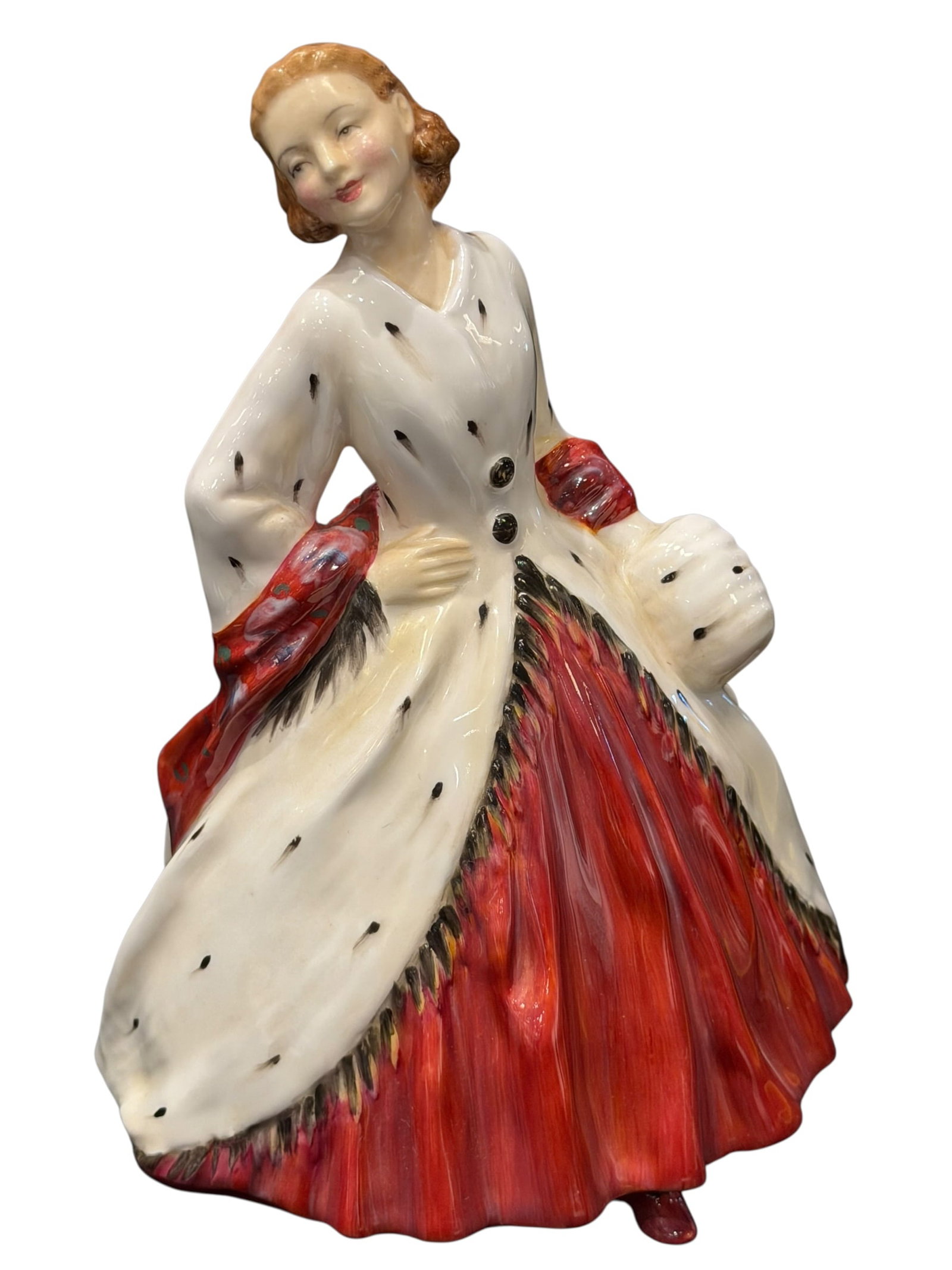 Royal Doulton "The Ermine Coat?? Porcelain Figurine: Vintage Royal Doulton “The Ermine Coat” English bone china figurine, HN 1981, copyright 1945. This elegant figure depicts a fashionable young woman with auburn hair wearing a dramatic cream-co