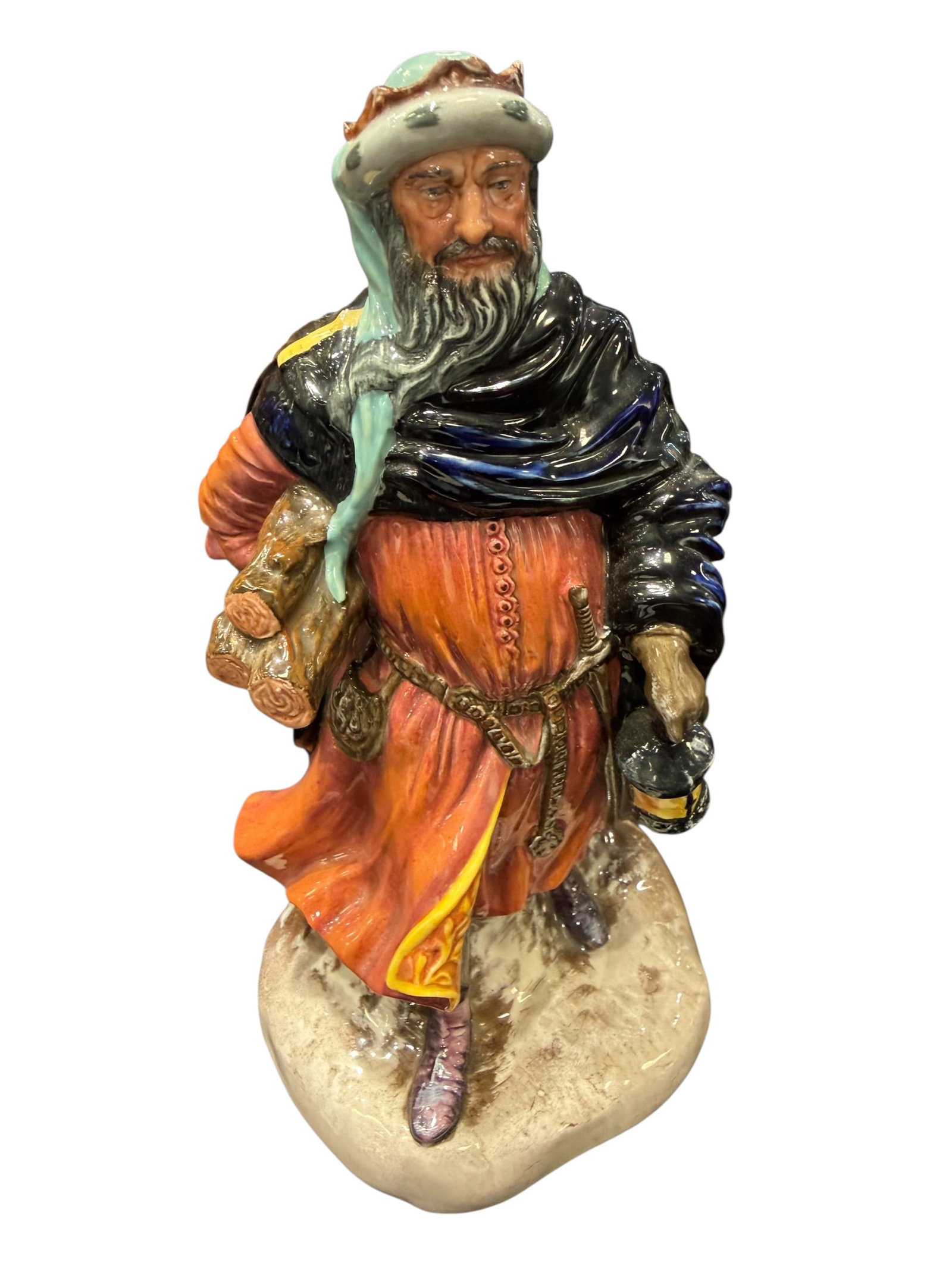 Royal Doulton “Good King Wenceslas?? Porcelain Figurine: Royal Doulton English bone china figurine titled “Good King Wenceslas,” HN 2118, copyright 1952. This finely modeled character depicts the legendary king dressed for winter travel, wearing a r