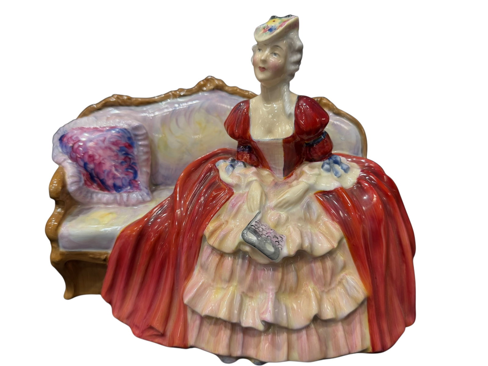 Royal Doulton “Belle O’ The Ball?? Porcelain Figurine: Vintage Royal Doulton bone china figurine “Belle O’ The Ball,” HN 1997, copyright 1946, made in England. This charming figure depicts an elegantly dressed young lady seated beside an