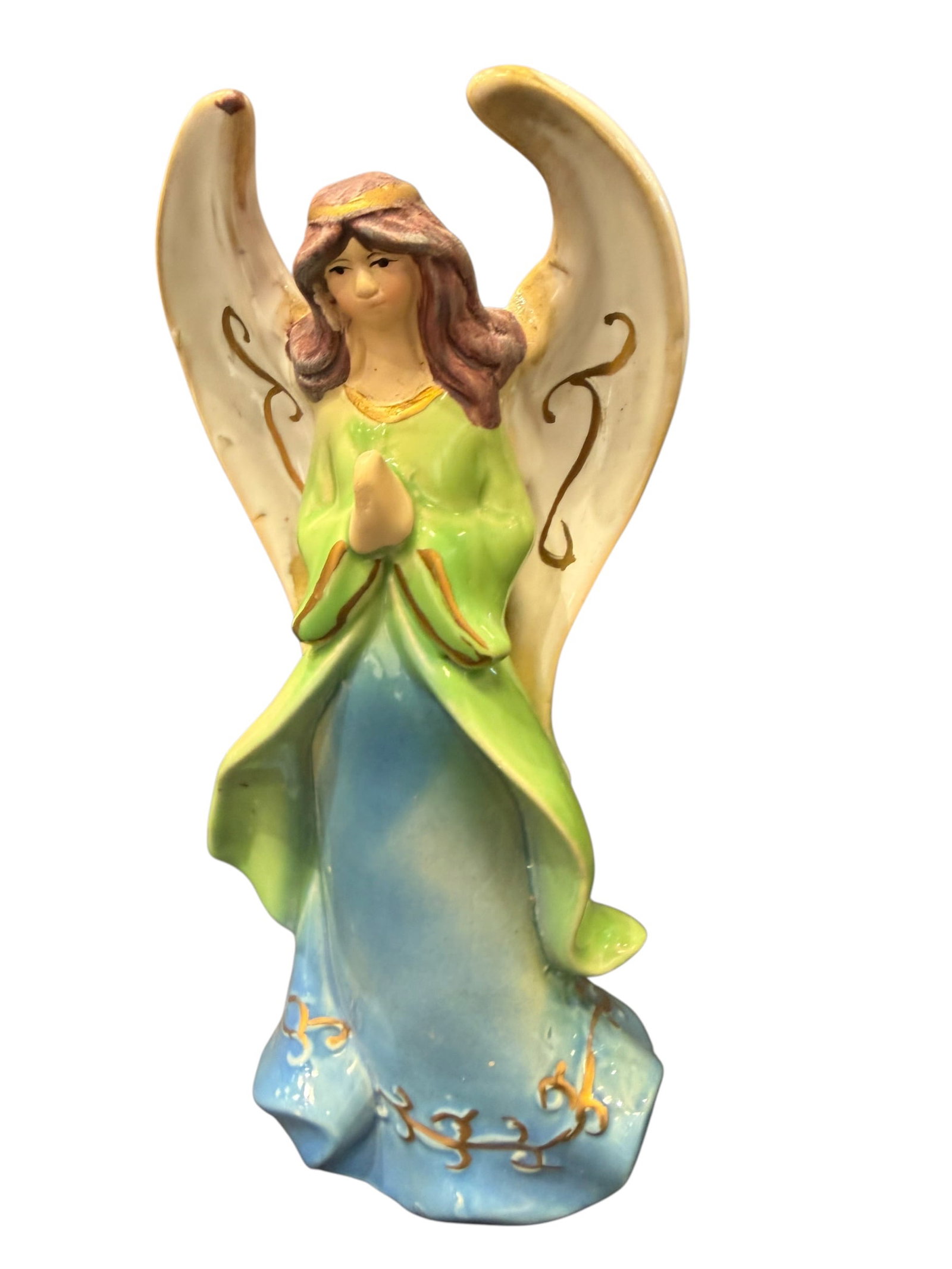 Porcelain Angel Figurine: Charming vintage glazed ceramic angel figurine depicting a young female angel with hands clasped in prayer. She is dressed in a flowing bright green robe over a blue gown, accented with hand-painted g