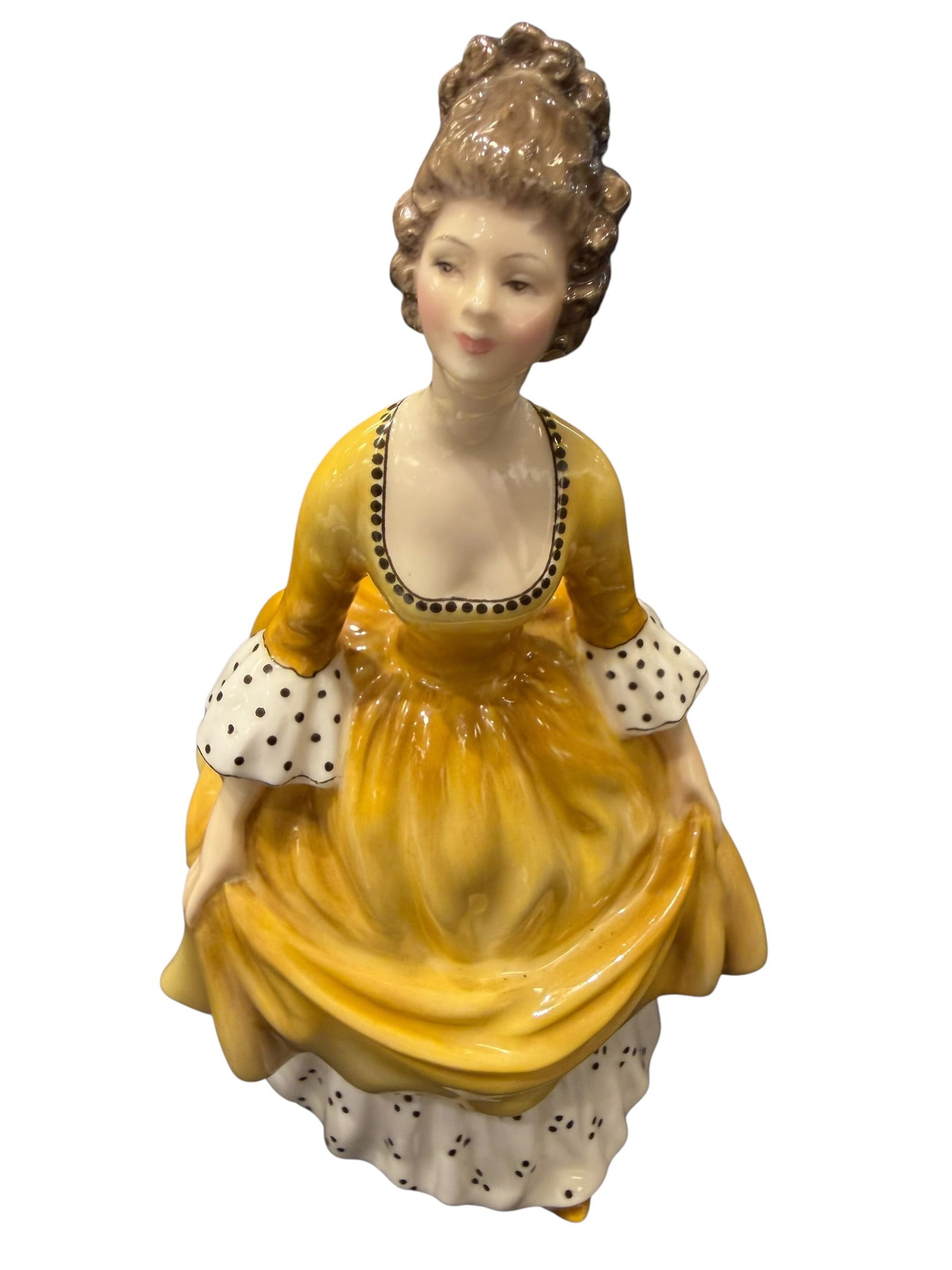 Royal Doulton “Coralie?? Porcelain Figurine: Royal Doulton English bone china figurine titled “Coralie,” HN 2307, depicting an elegantly dressed young woman in a flowing golden-yellow period gown. Her dress features white flared