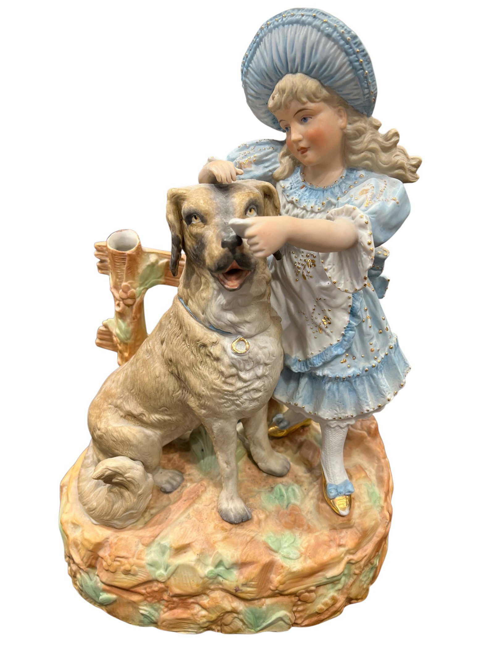 German Bisque Porcelain Statue: Large and highly detailed porcelain figural group depicting a young Victorian-era girl with her faithful dog. The girl is dressed in an elaborate pale blue and white costume with matching bonnet,
