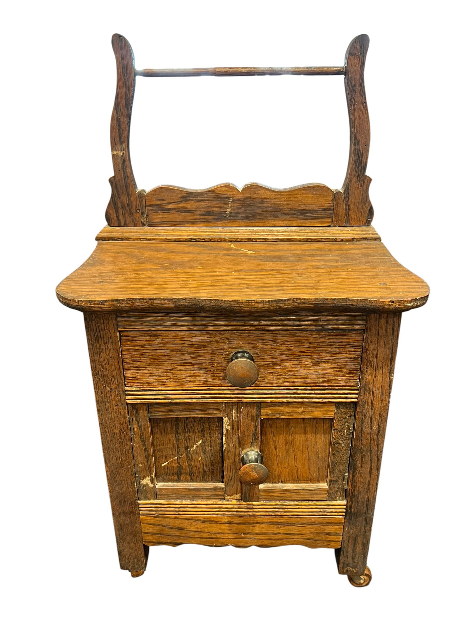 Antique Oak Child’s Doll Washstand / Vanity Cabinet with Towel Bar – Circa 1900: Charming antique miniature oak washstand or doll-sized vanity cabinet, likely dating to the late 19th or early 20th century. Constructed in oak with attractive grain and a warm aged finish, the piece 