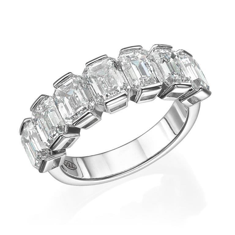 5.12 tcw Emerald Cut Natural Diamond in 18k White Gold Wedding Ring: A beautiful emerald cut wedding band, set in 18K white gold with top-quality natural diamonds. This 7-stone ring is one of a kind.Specifications: 7 stones emerald cut natural diamonds, total weight o