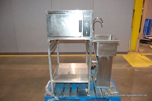HOBART Steamer Model 052400-00AX and Hands Free Sink: HOBART Steamer with Stand-MDL 052400-00AX, S/N-AP1009836-7R-3825, 208V, Phase 3, Cycle 60, 7.5KW, 20.8 AMPS - DIMS are 28L x 24W x 51H. QTY 1ea UNIVERSAL STAINLESS single faucet sink Model NSF D023021
