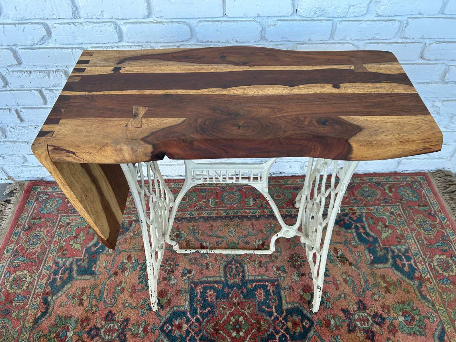 Custom walnut & maple top, cast iron base table: Custom walnut an Maple wood top table mounted on an antique cast-iron, singer, sewing machine base.