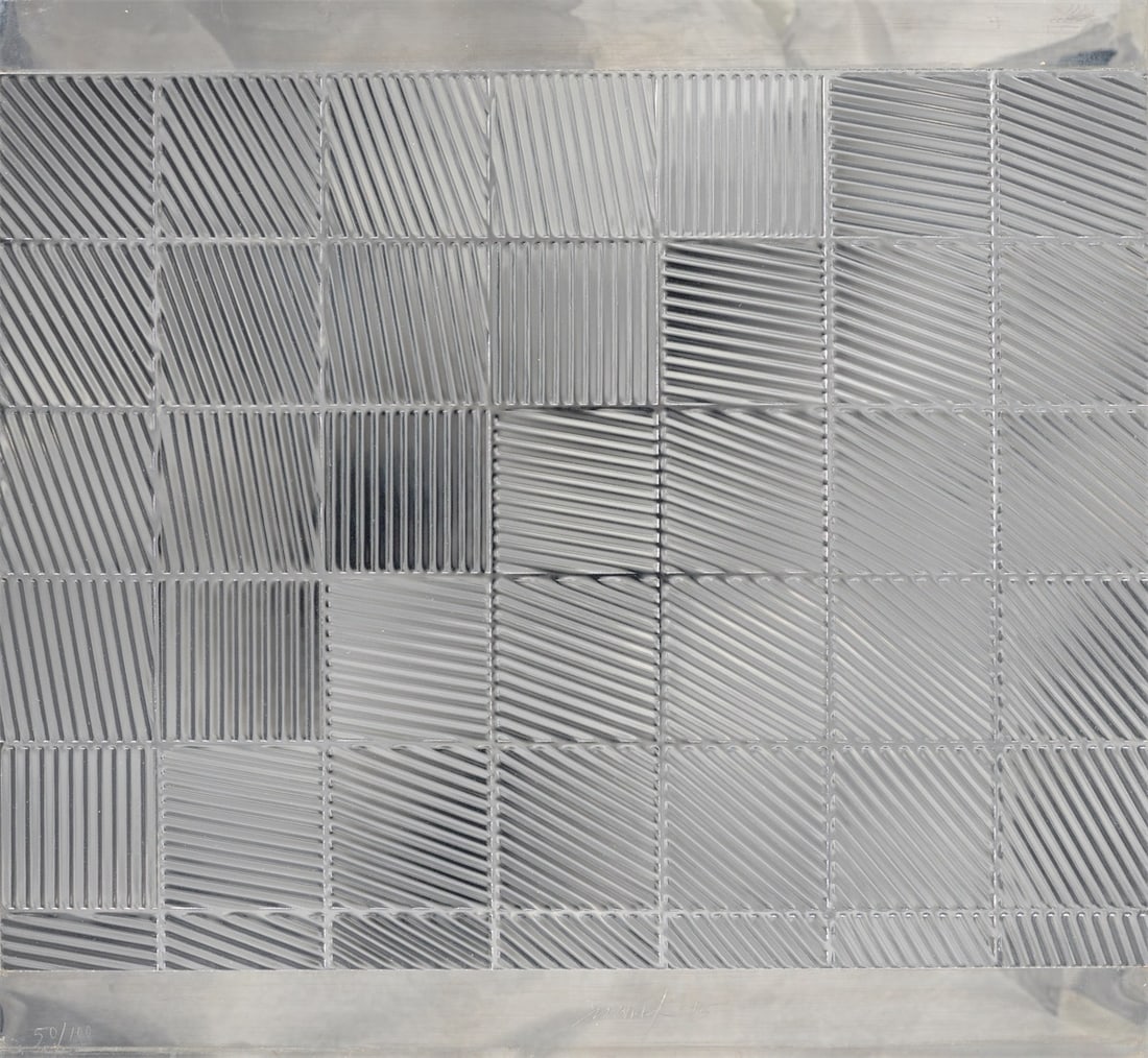 Heinz Mack. ”Schachbrett”. 1975: Heinz Mack (Lollar 1931 – lives in Mönchengladbach). ”Schachbrett”. 1975 Embossing on aluminium, mounted on stainless steel plate. 33,6 × 43 cm (40 