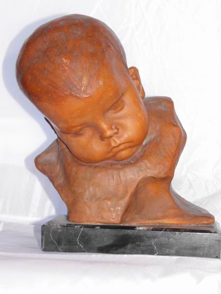 Terracotta Bust: Terracotta bust of a child marble base, signed Ezio Ceccarelli (1865-1927), h.25x17 cm.
