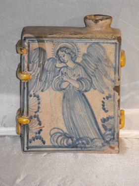 04: FLASK IN BOOK FORM SICILY 18TH. C.: Flask in book form,decorated in blue figure of the Archangel, and some details in relief. Sicily 18th. century. Size: h.17x12 cm (6.7"x4.73")